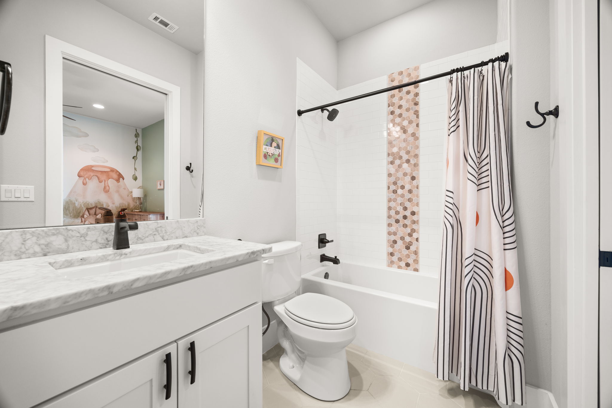 7809 Brandy Way Volente, TX 78641 - Photo 20 of 40 a bathroom with a granite countertop sink toilet a mirror a bathtub and shower