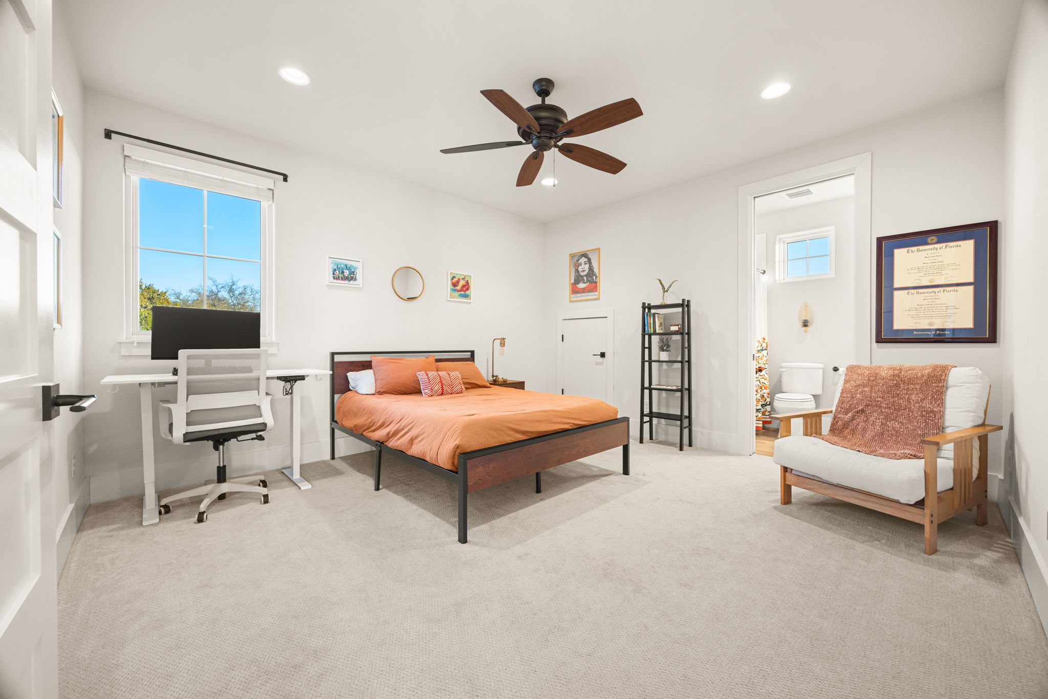 7809 Brandy Way Volente, TX 78641 - Photo 25 of 40 a bedroom with a bed and a chandelier