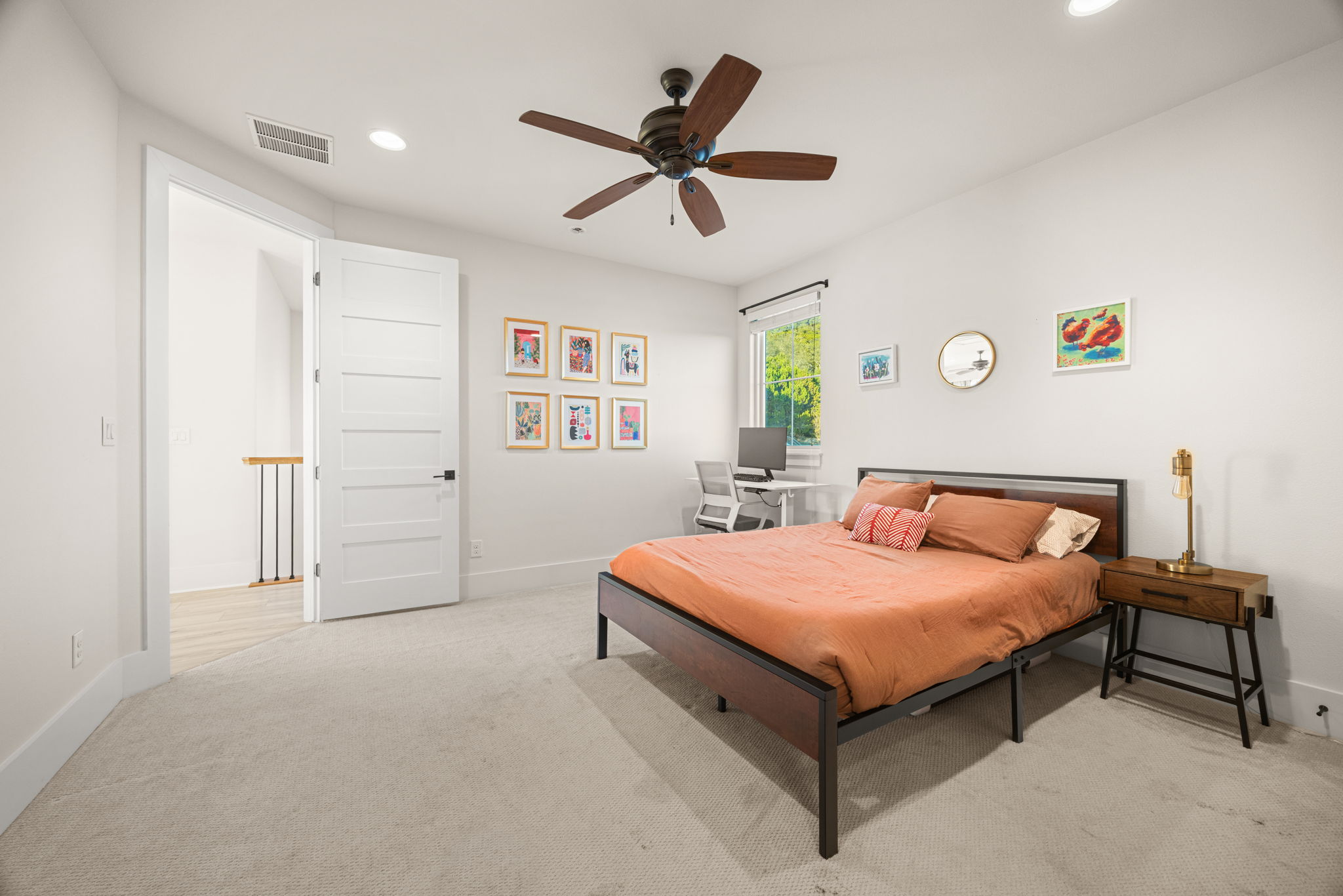 7809 Brandy Way Volente, TX 78641 - Photo 26 of 40 a bed room with a bed and a ceiling fan