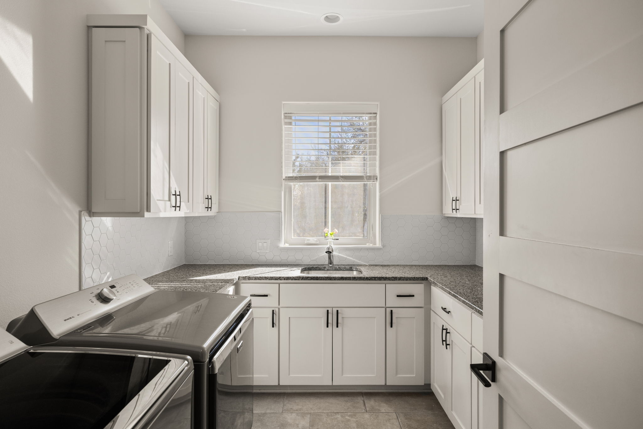 7809 Brandy Way Volente, TX 78641 - Photo 29 of 40 a kitchen with a sink stove and cabinets