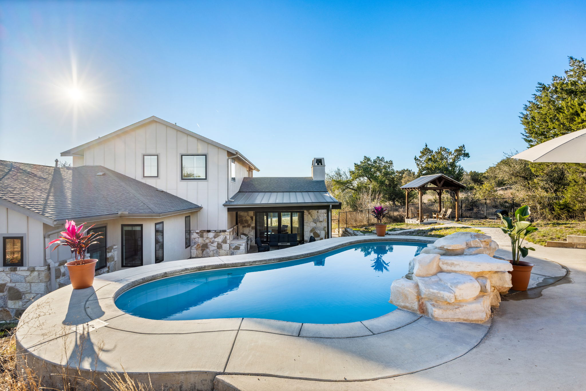 7809 Brandy Way Volente, TX 78641 - Photo 34 of 40 a view of a house with swimming pool and sitting area