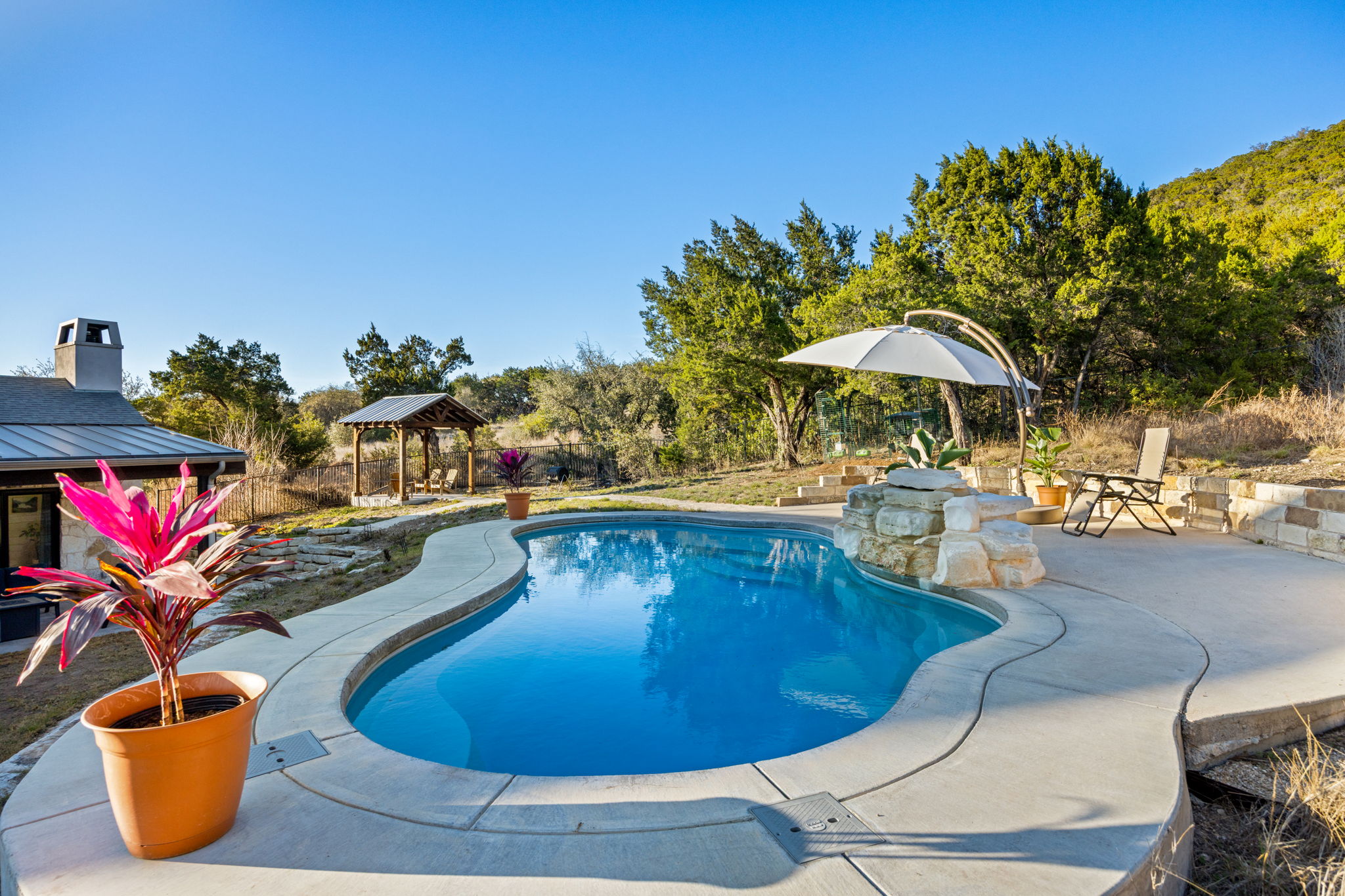 7809 Brandy Way Volente, TX 78641 - Photo 35 of 40 a view of a swimming pool with lounge chairs