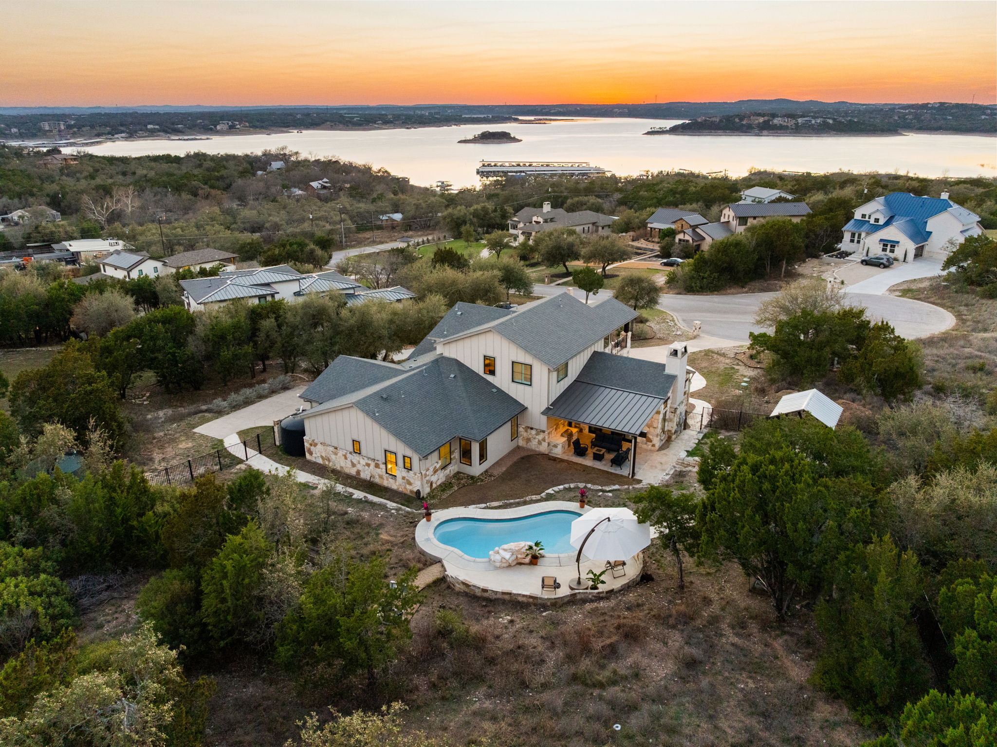 7809 Brandy Way Volente, TX 78641 - Photo 38 of 40 an aerial view of a house with garden space and ocean view