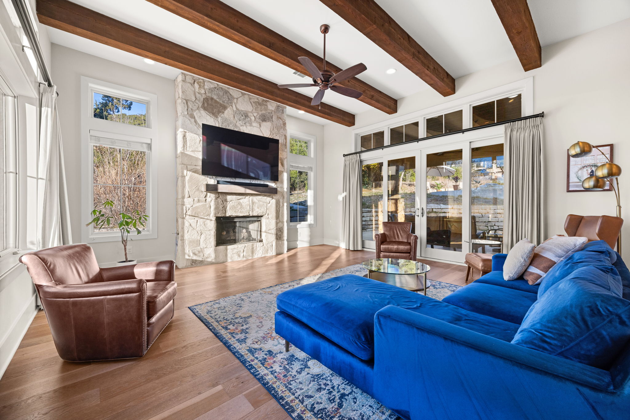 7809 Brandy Way Volente, TX 78641 - Photo 7 of 40 a living room with furniture fireplace and flat screen tv