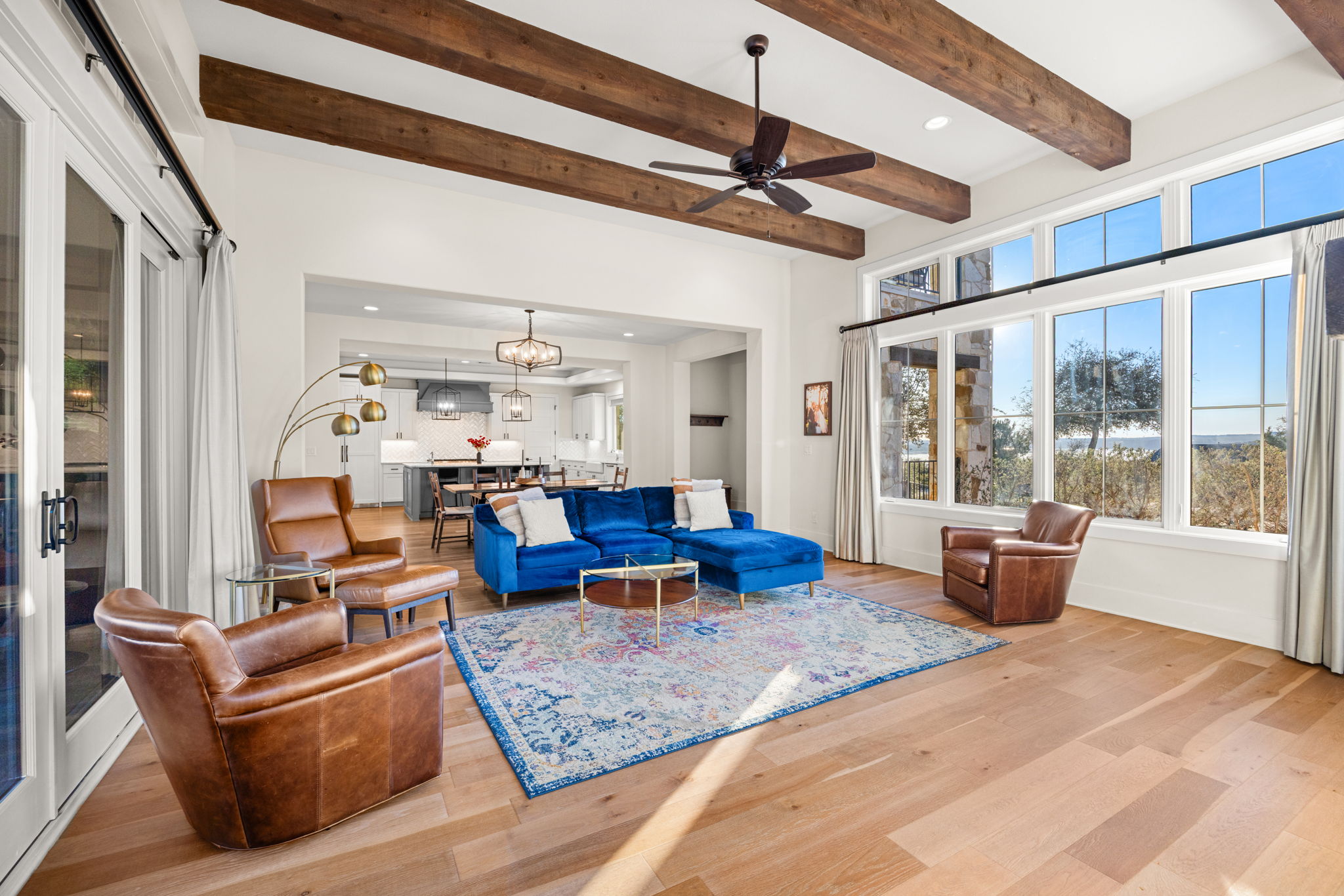 7809 Brandy Way Volente, TX 78641 - Photo 8 of 40 a living room with furniture and a chandelier