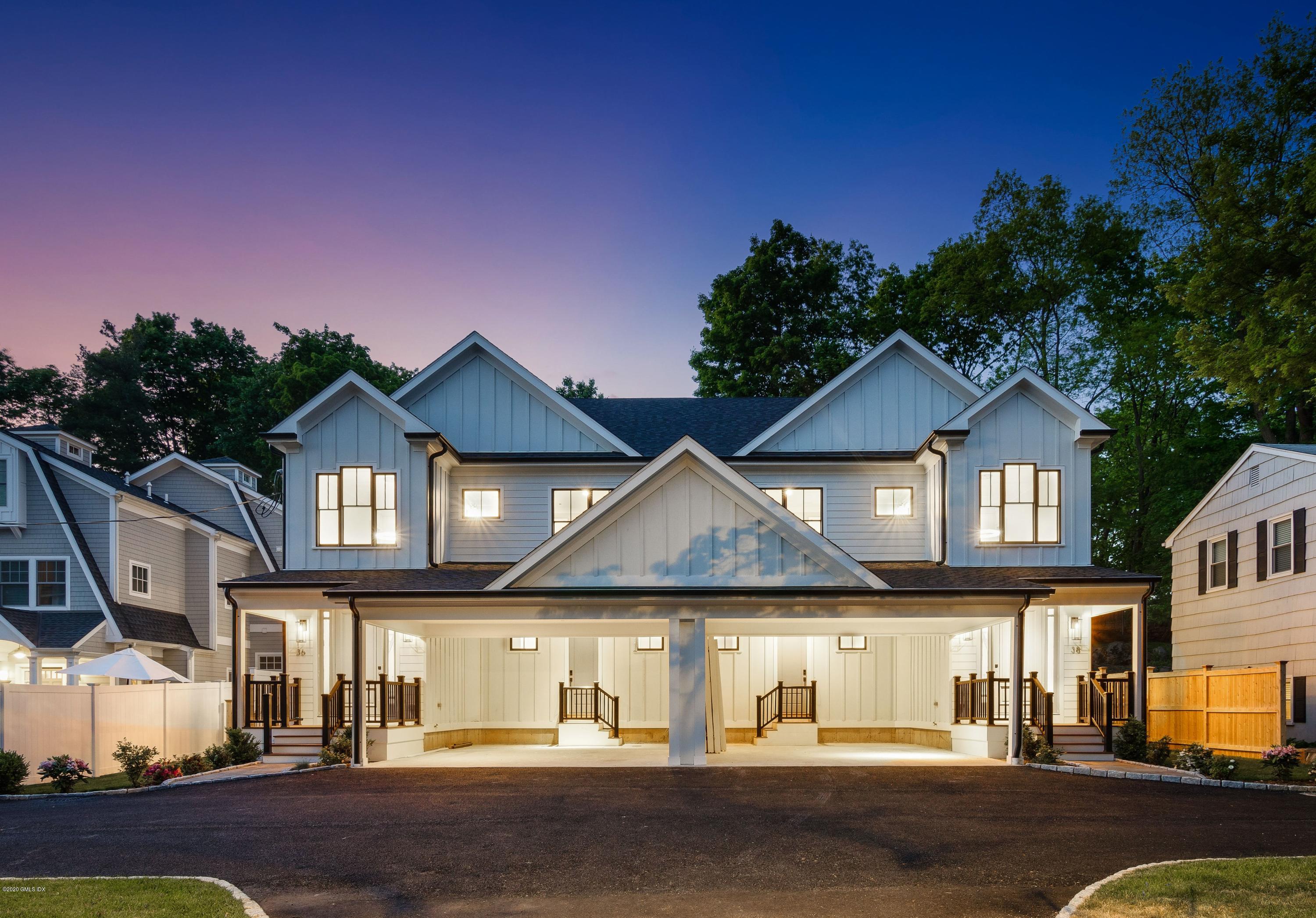 38 Cassidy Street, Unit 38 Greenwich, CT 06830 - Photo 1 of 50 a front view of a house with a yard