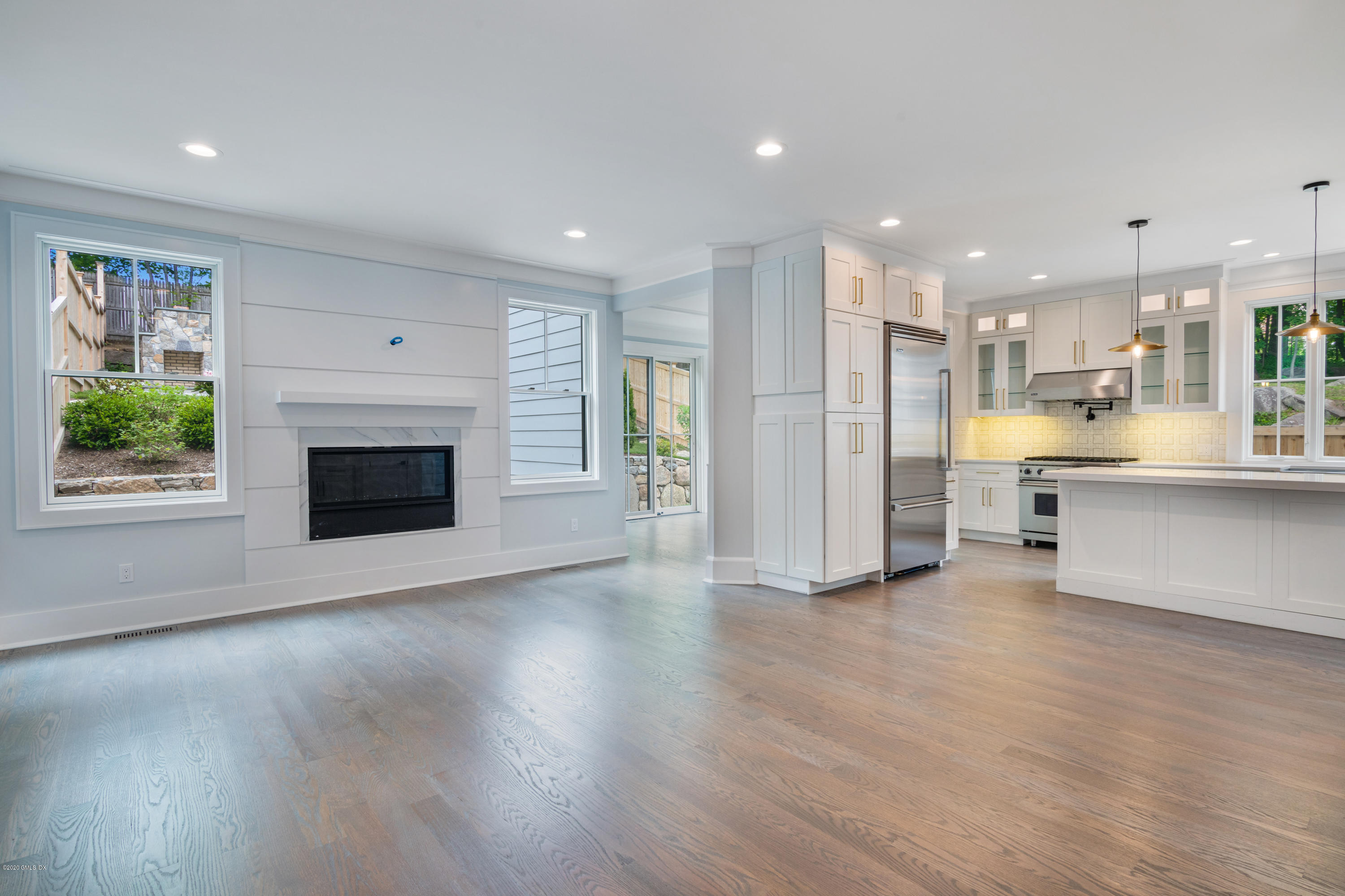 38 Cassidy Street, Unit 38 Greenwich, CT 06830 - Photo 13 of 50 a view of a kitchen with a sink a fireplace and window