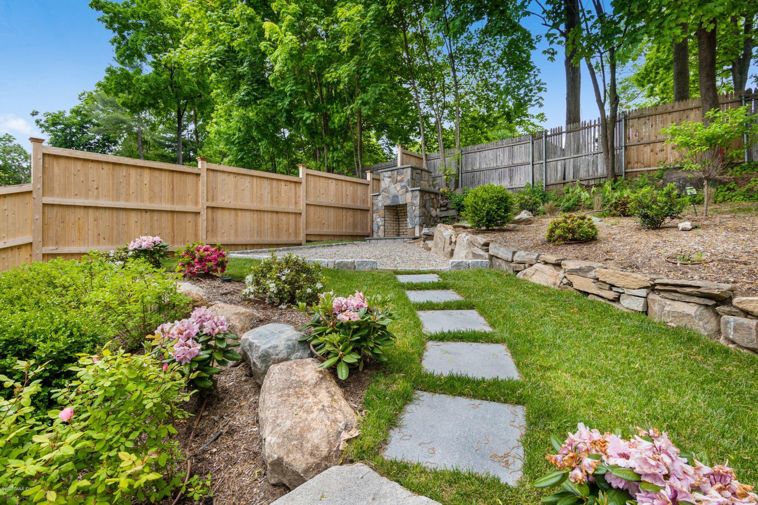 38 Cassidy Street, Unit 38 Greenwich, CT 06830 - Photo 19 of 50 a view of a backyard with a garden