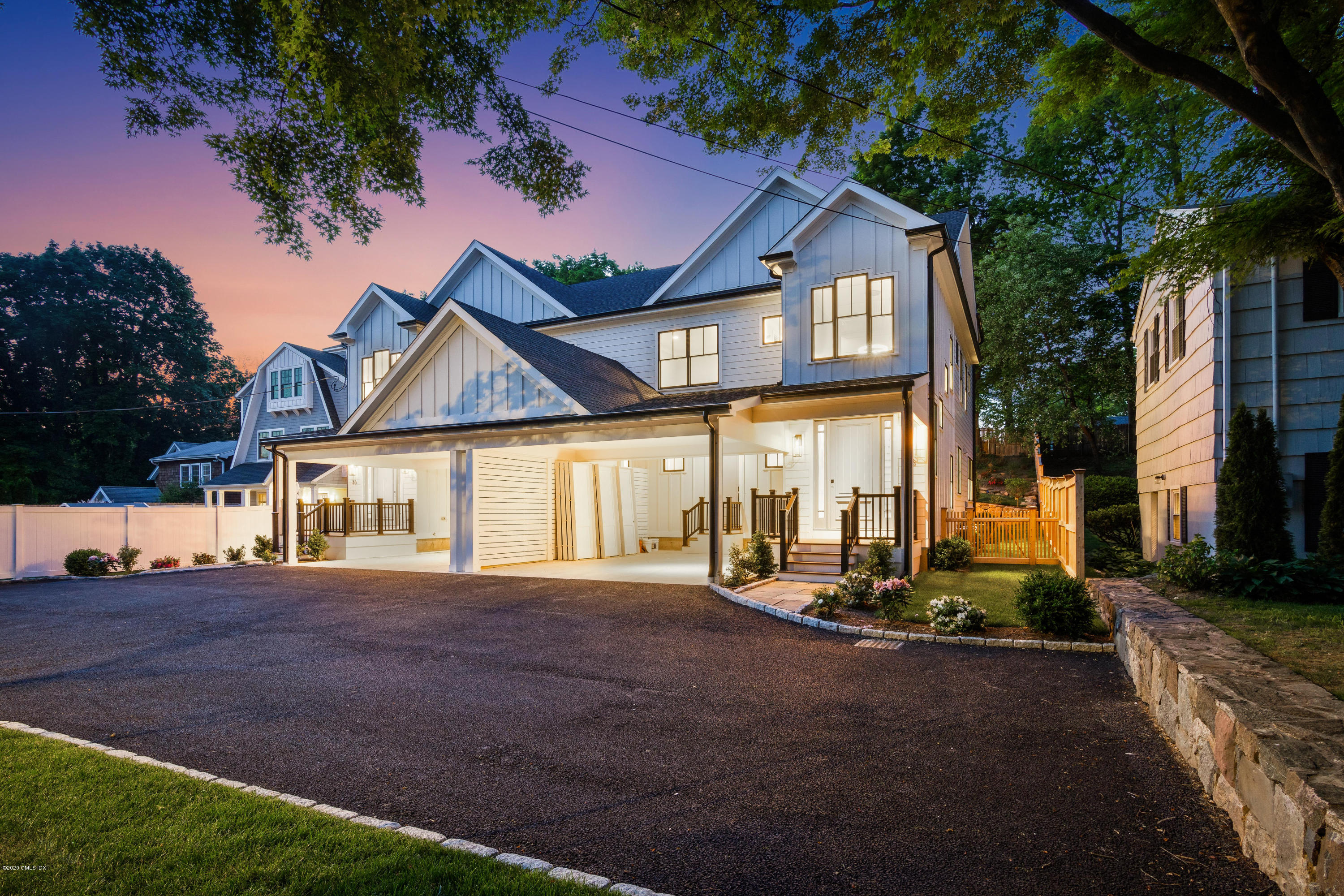 38 Cassidy Street, Unit 38 Greenwich, CT 06830 - Photo 2 of 50 a front view of a house with a yard