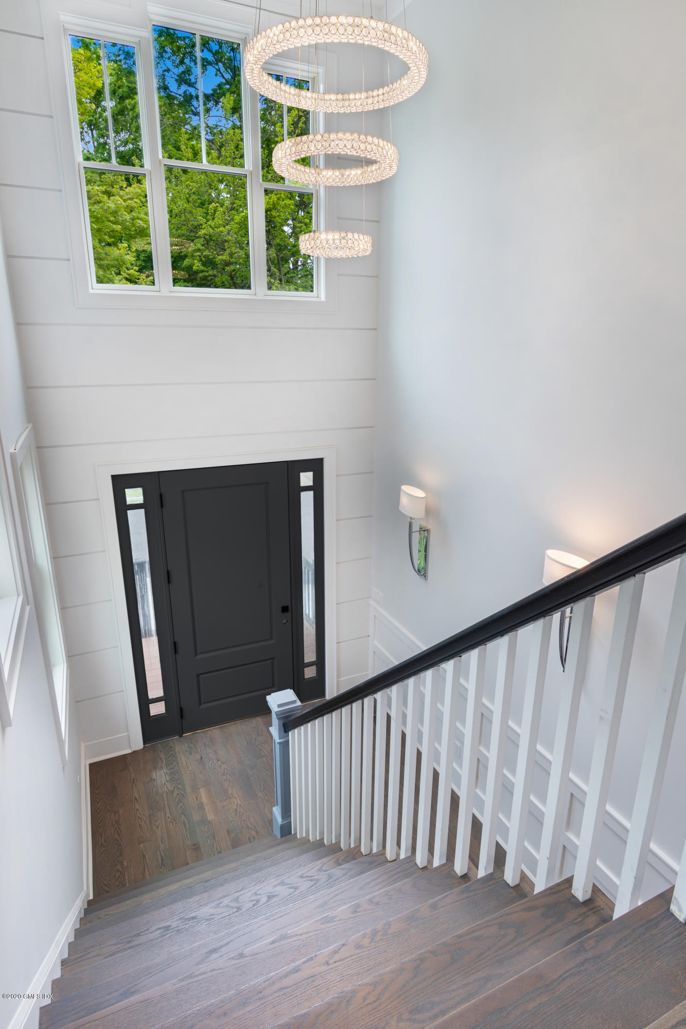 38 Cassidy Street, Unit 38 Greenwich, CT 06830 - Photo 21 of 50 a view of entryway with stairs and wooden floor