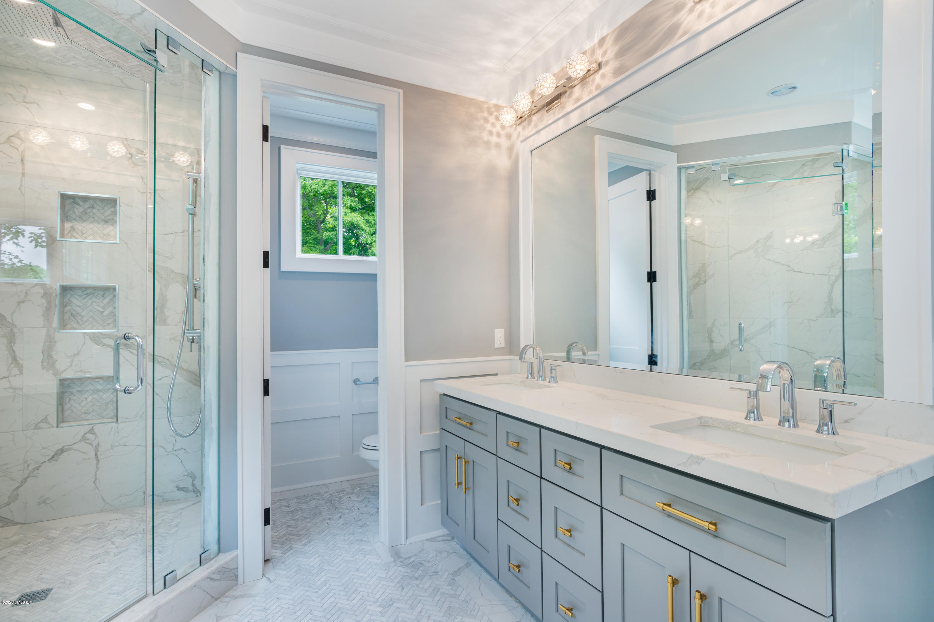 38 Cassidy Street, Unit 38 Greenwich, CT 06830 - Photo 26 of 50 a bathroom with a sink double vanity and a shower