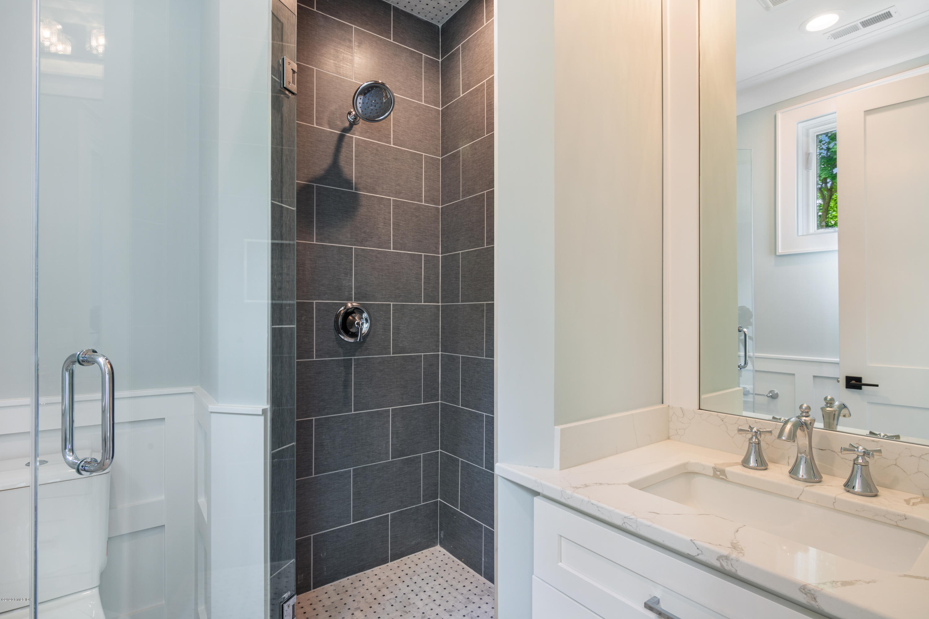 38 Cassidy Street, Unit 38 Greenwich, CT 06830 - Photo 28 of 50 a bathroom with a sink shower and a mirror