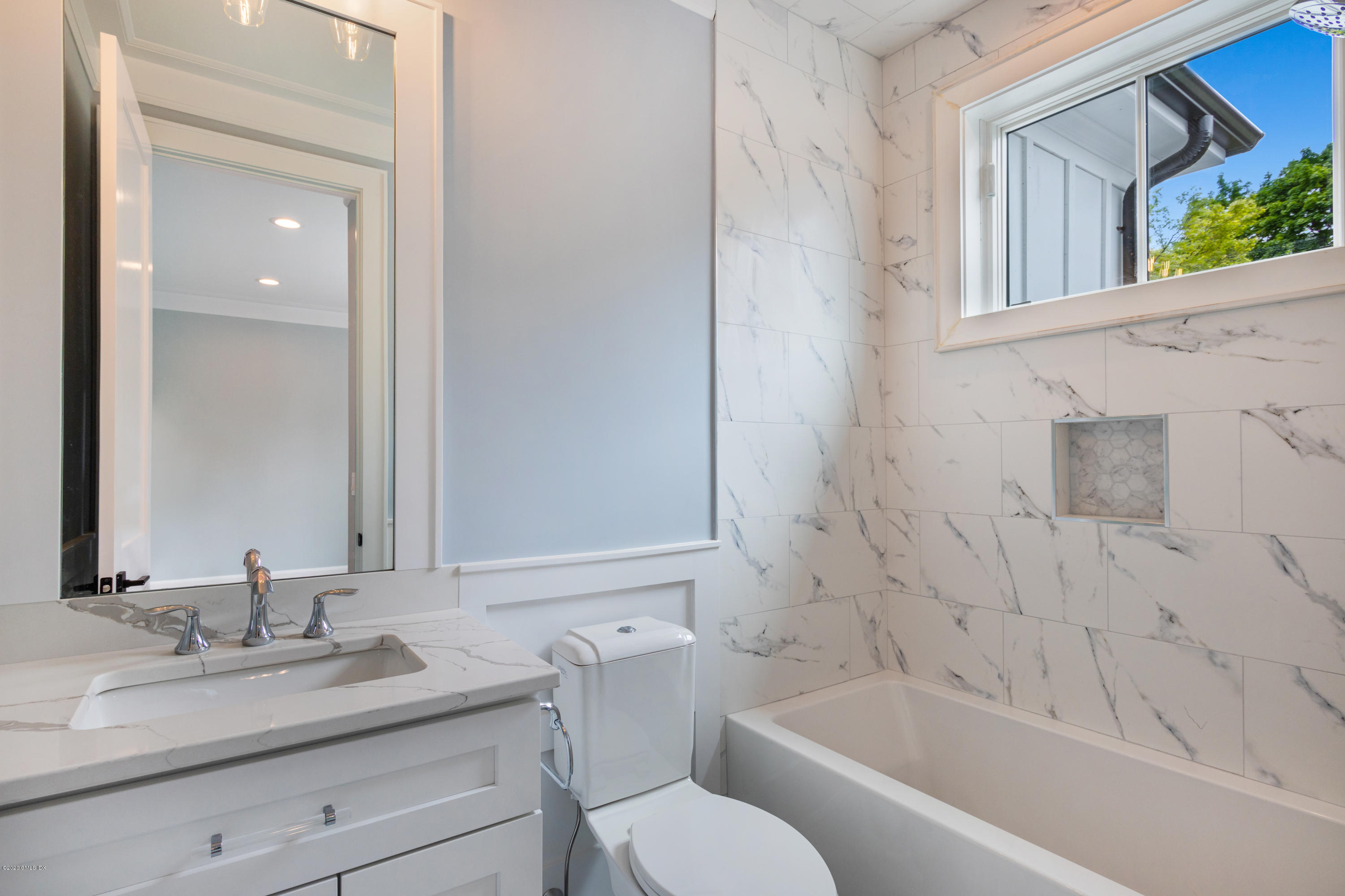 38 Cassidy Street, Unit 38 Greenwich, CT 06830 - Photo 32 of 50 a bathroom with a granite countertop sink toilet and bathtub