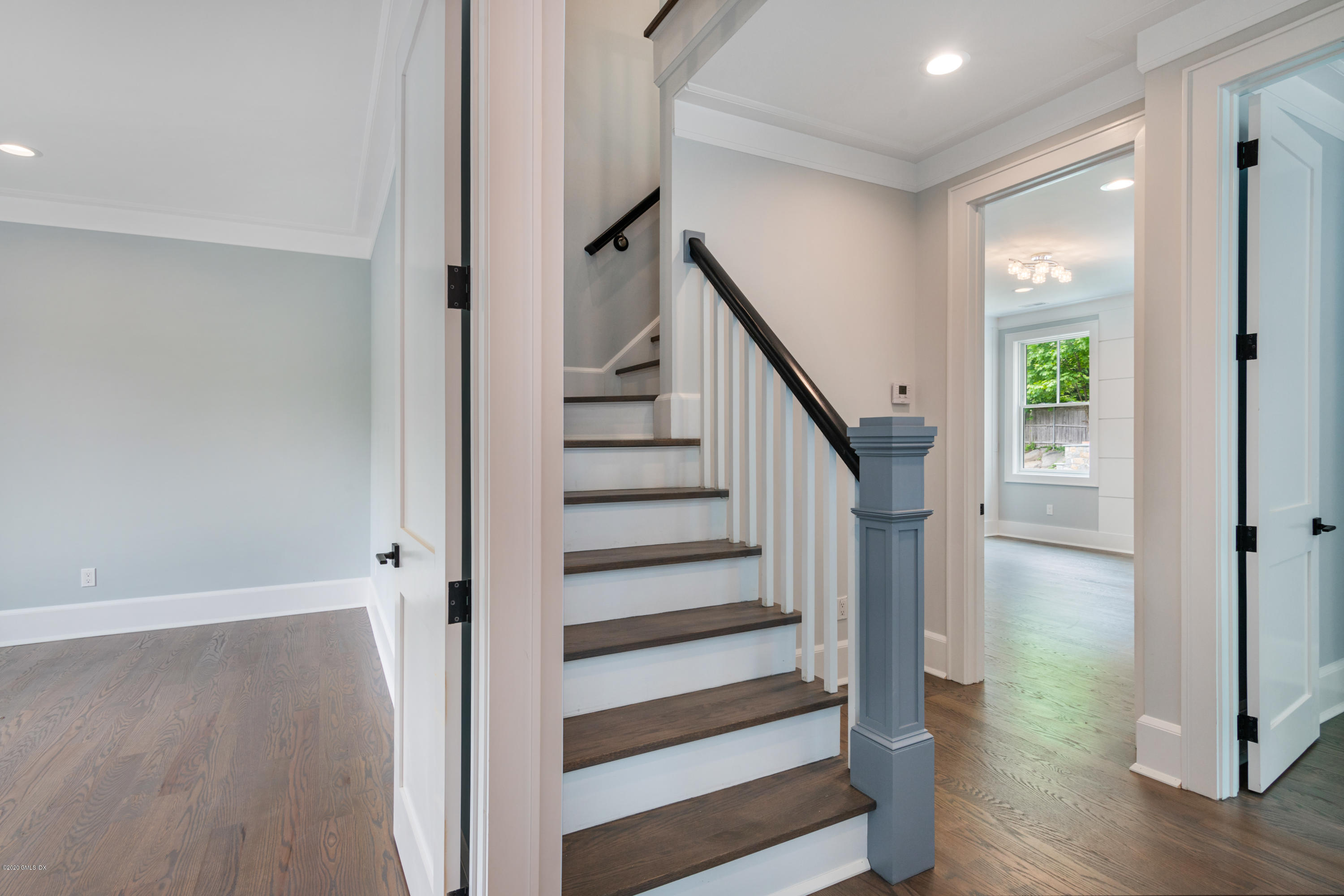 38 Cassidy Street, Unit 38 Greenwich, CT 06830 - Photo 33 of 50 a view of entryway with wooden floor and stairs