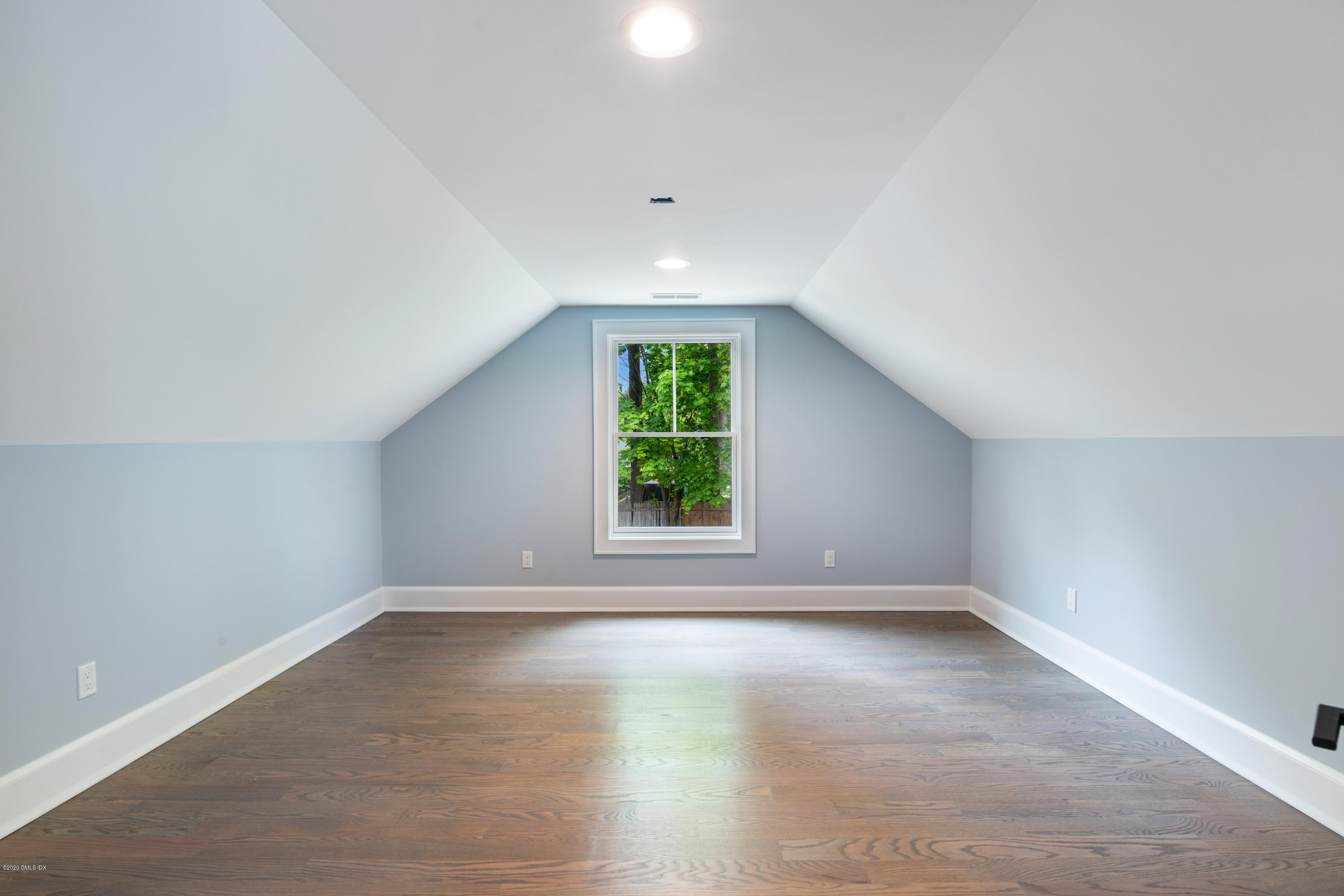 38 Cassidy Street, Unit 38 Greenwich, CT 06830 - Photo 37 of 50 wooden floor in an empty room with a window