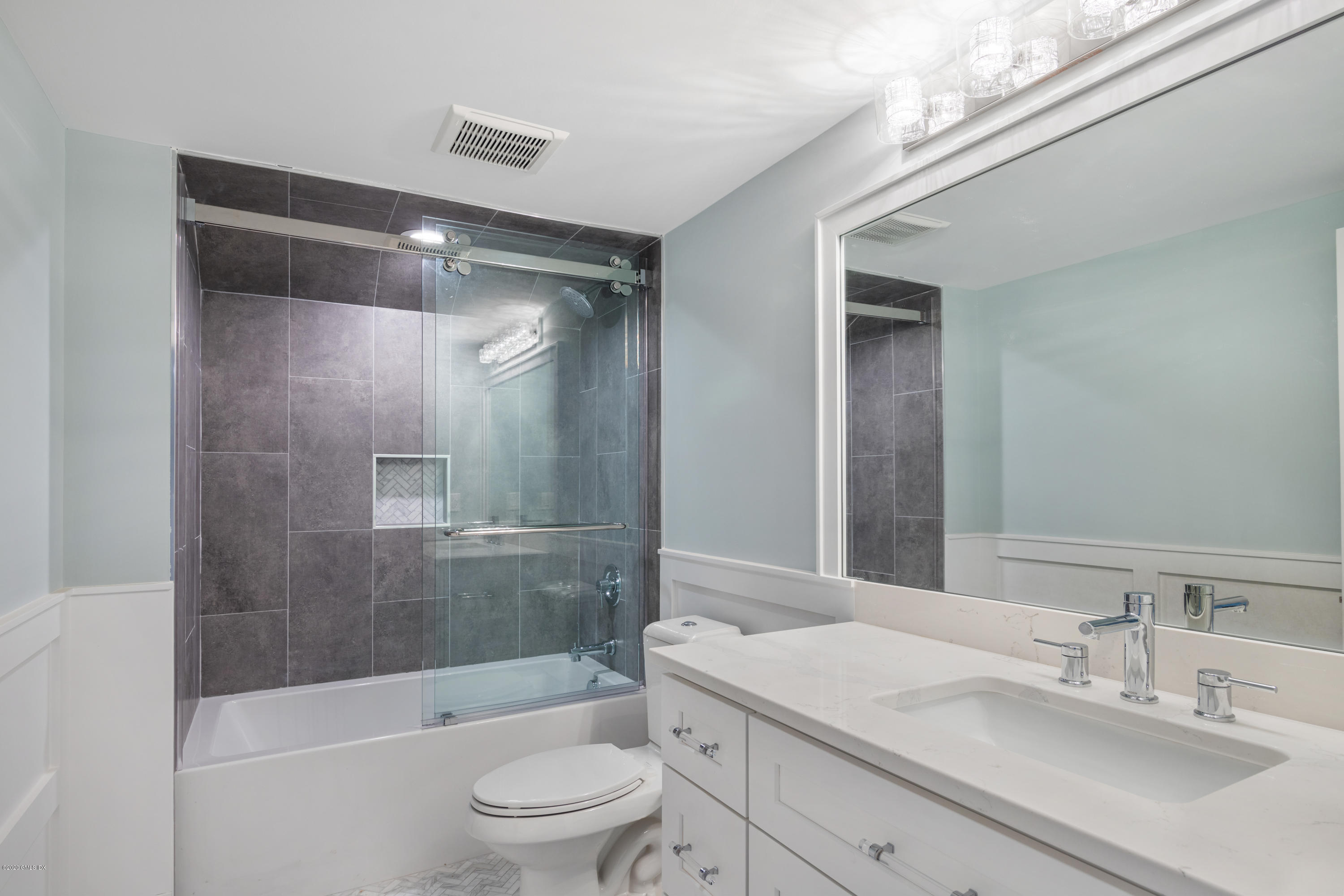 38 Cassidy Street, Unit 38 Greenwich, CT 06830 - Photo 38 of 50 a bathroom with a sink a toilet and shower