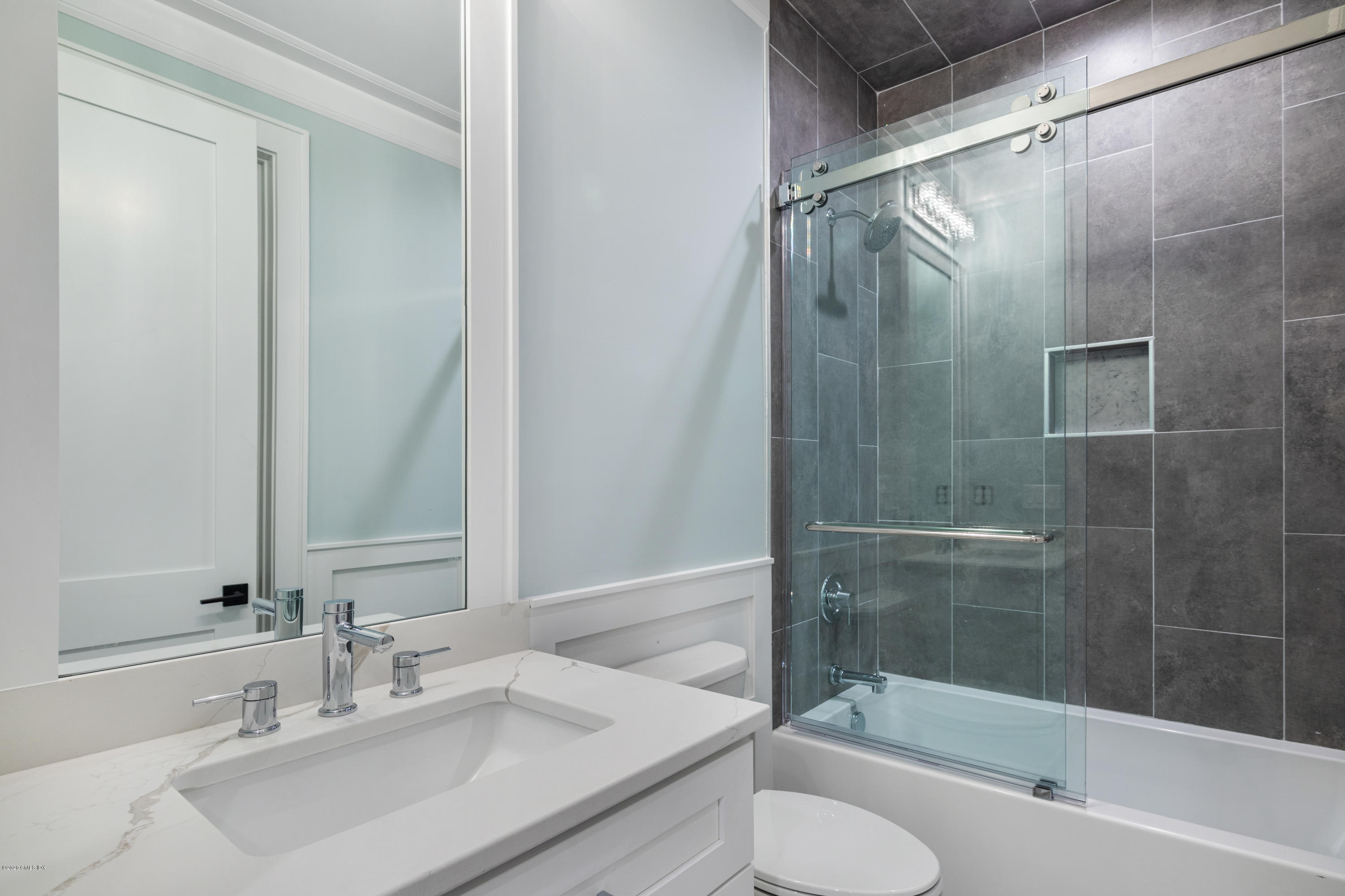 38 Cassidy Street, Unit 38 Greenwich, CT 06830 - Photo 42 of 50 a bathroom with a sink and a mirror