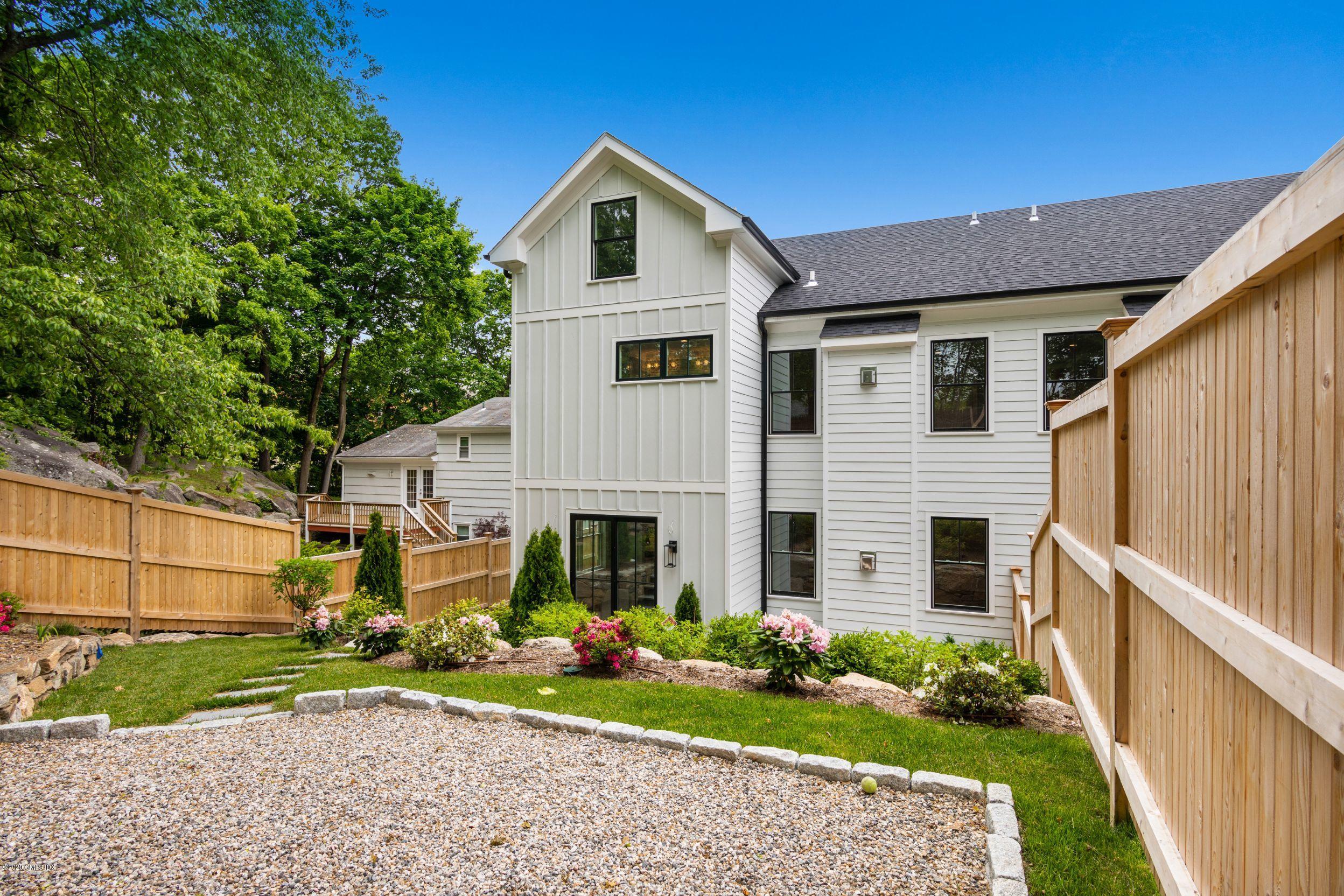 38 Cassidy Street, Unit 38 Greenwich, CT 06830 - Photo 6 of 50 a front view of a house with garden