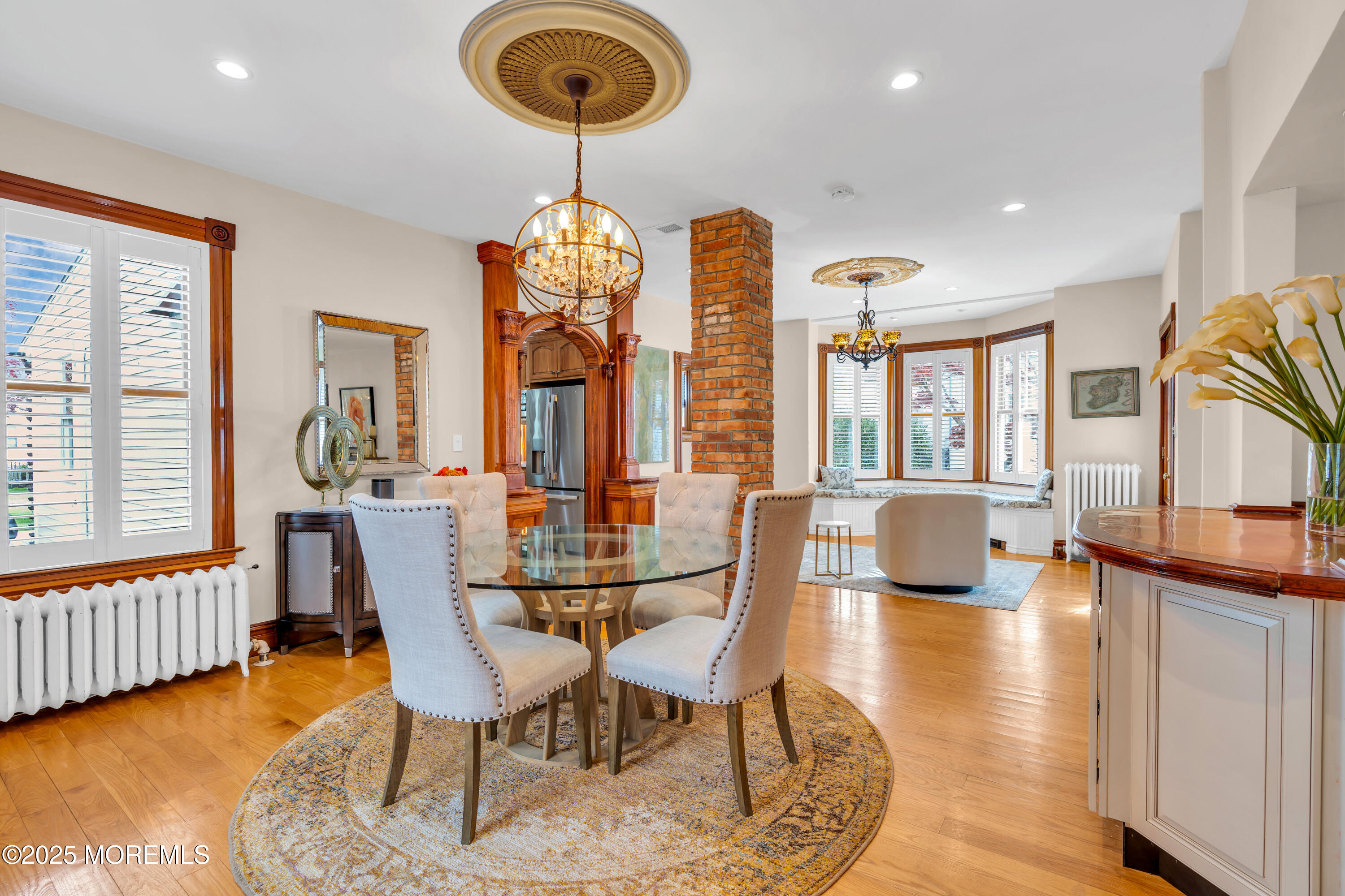 44 Irving Place Red Bank, NJ 07701 - Photo 18 of 74 a view of a dining room with furniture a chandelier and wooden floor