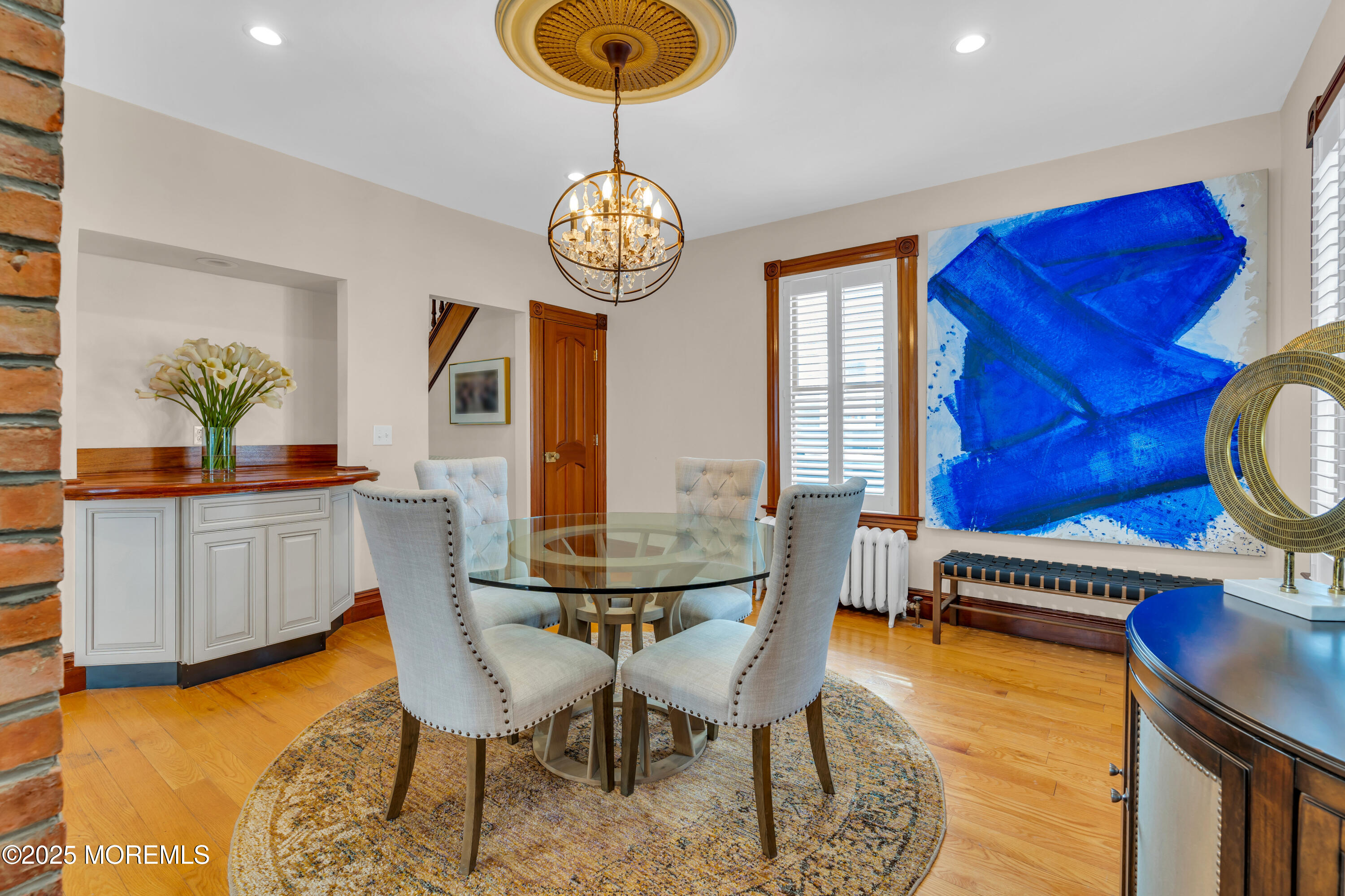 44 Irving Place Red Bank, NJ 07701 - Photo 20 of 74 a view of a dining room with furniture a chandelier and wooden floor