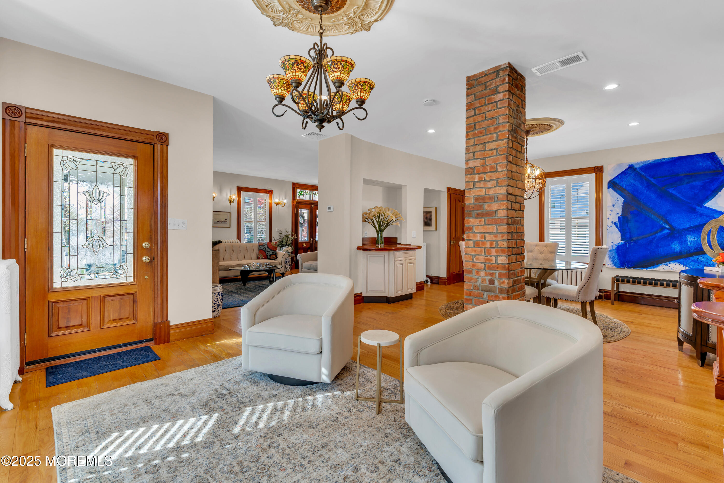 44 Irving Place Red Bank, NJ 07701 - Photo 24 of 74 a living room with fireplace furniture and a chandelier