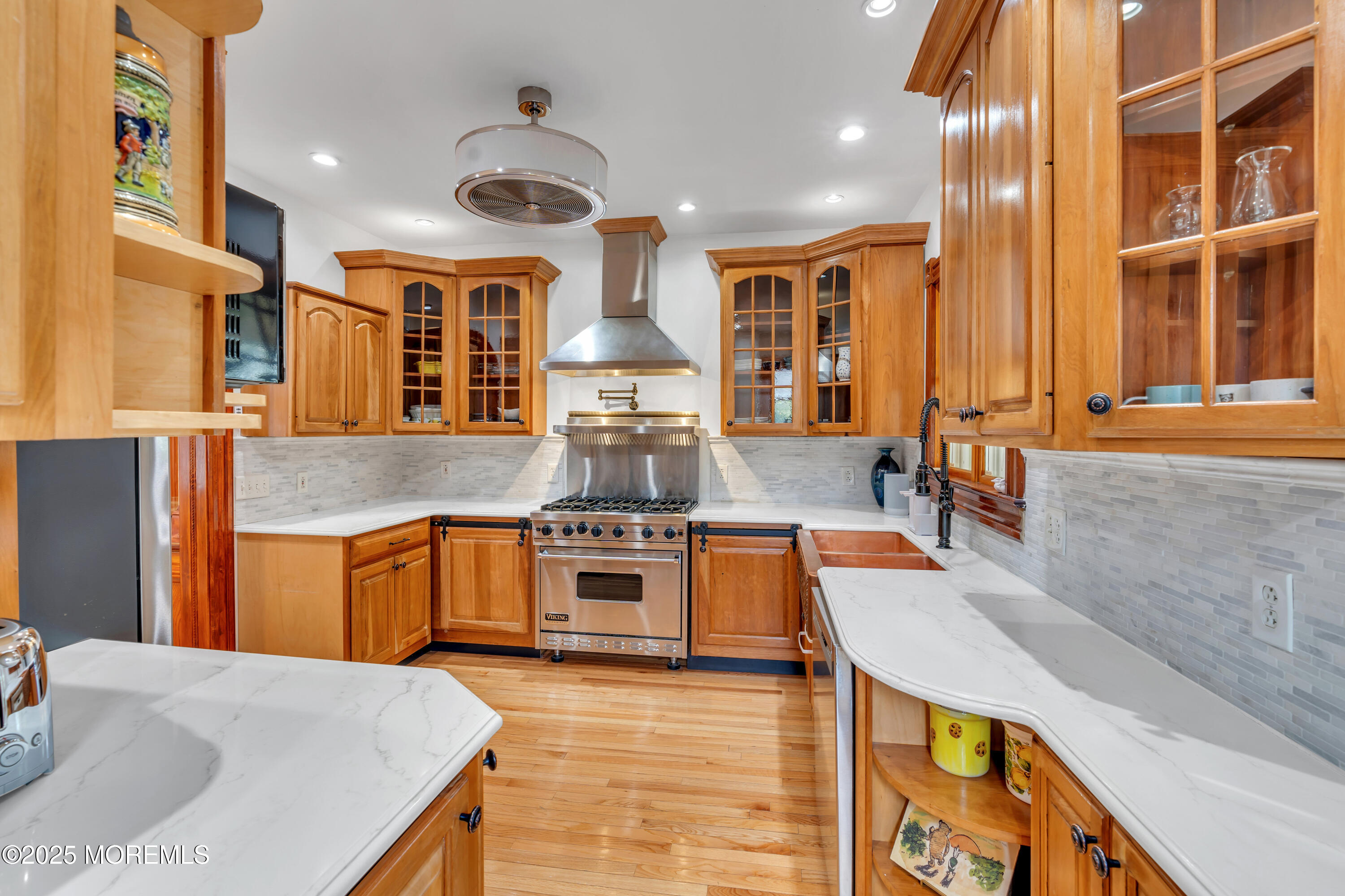 44 Irving Place Red Bank, NJ 07701 - Photo 27 of 74 a large kitchen with stainless steel appliances granite countertop a stove and a refrigerator