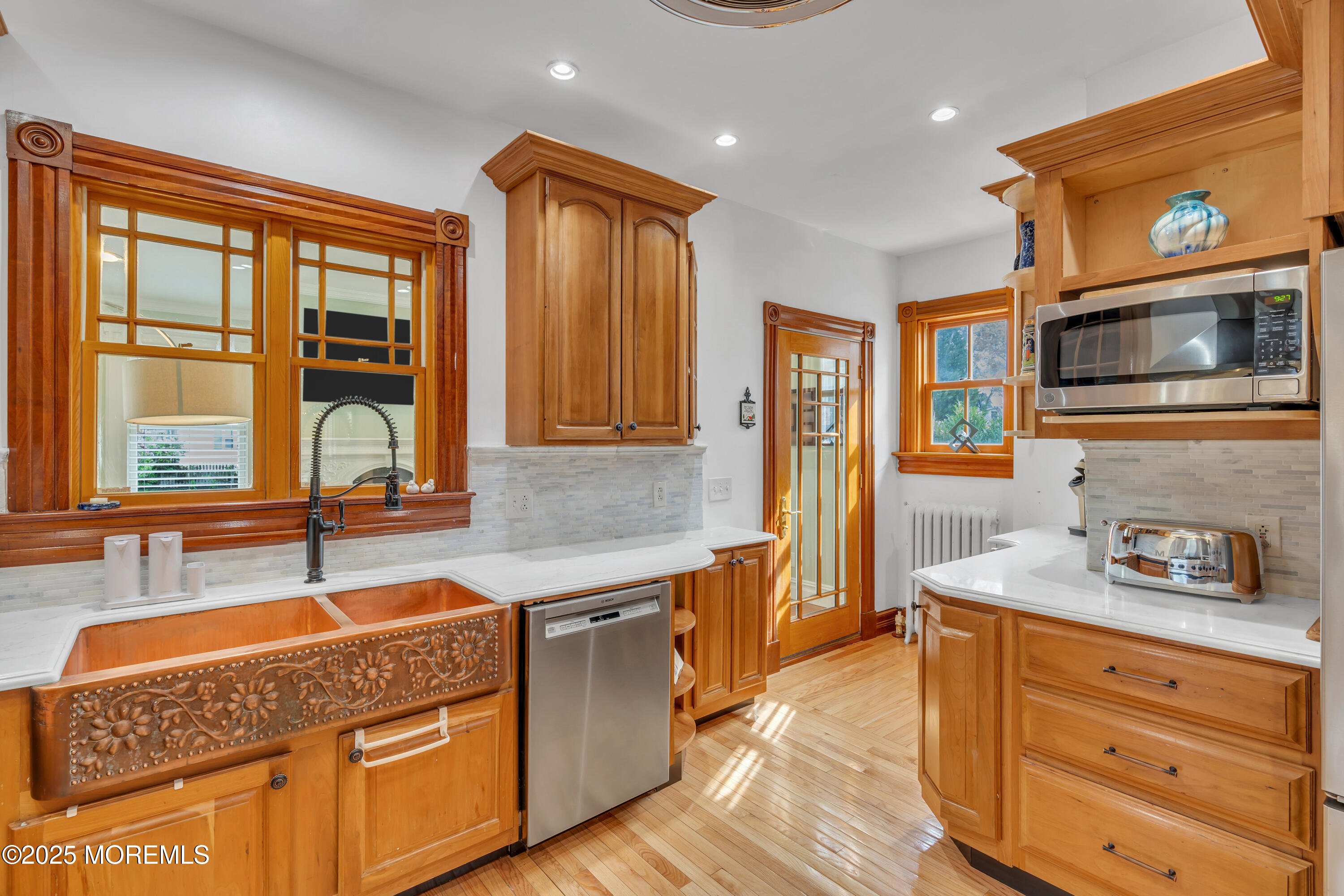 44 Irving Place Red Bank, NJ 07701 - Photo 28 of 74 a kitchen with stainless steel appliances granite countertop a sink and wooden cabinets
