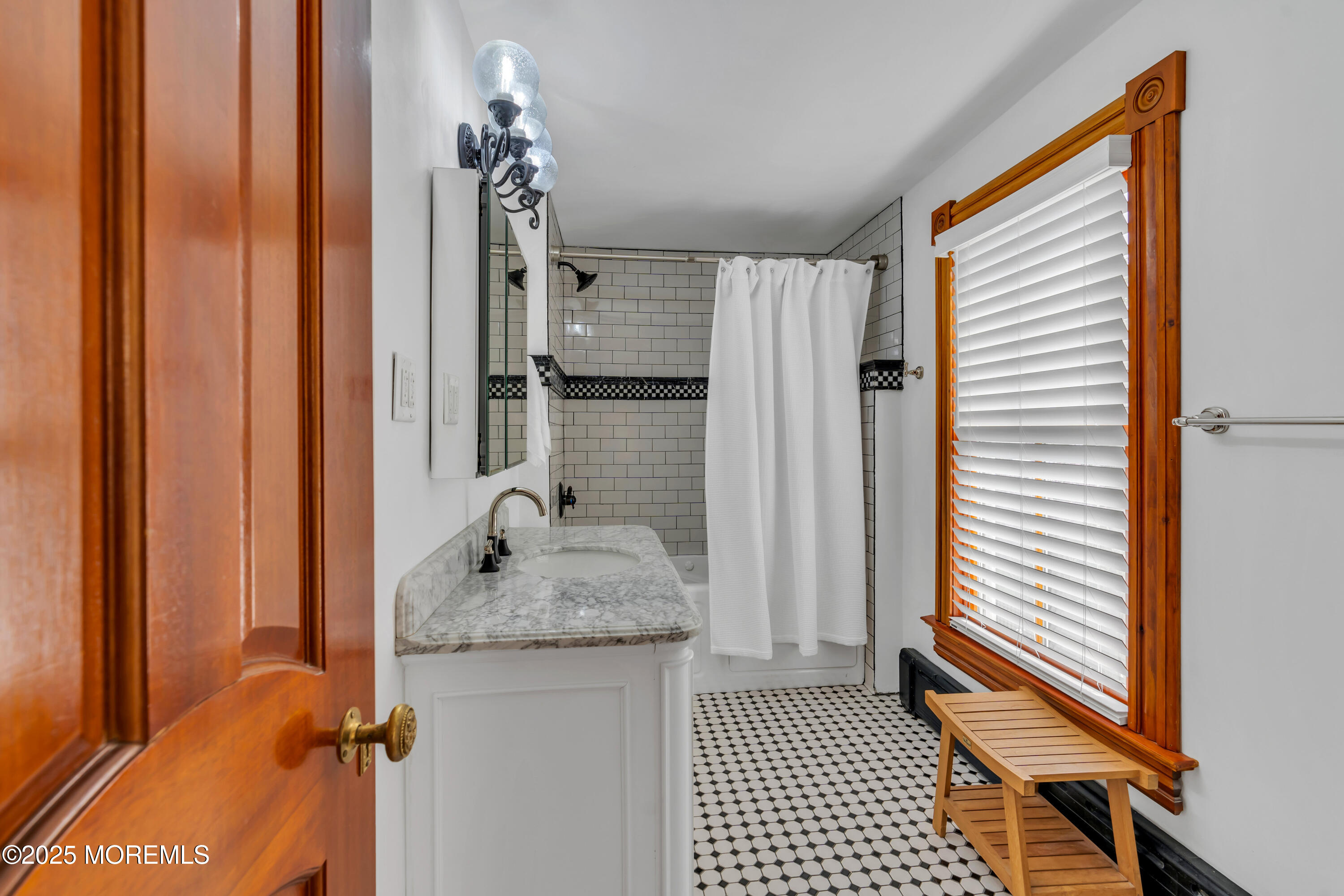 44 Irving Place Red Bank, NJ 07701 - Photo 42 of 74 a bathroom with a granite countertop sink and a mirror