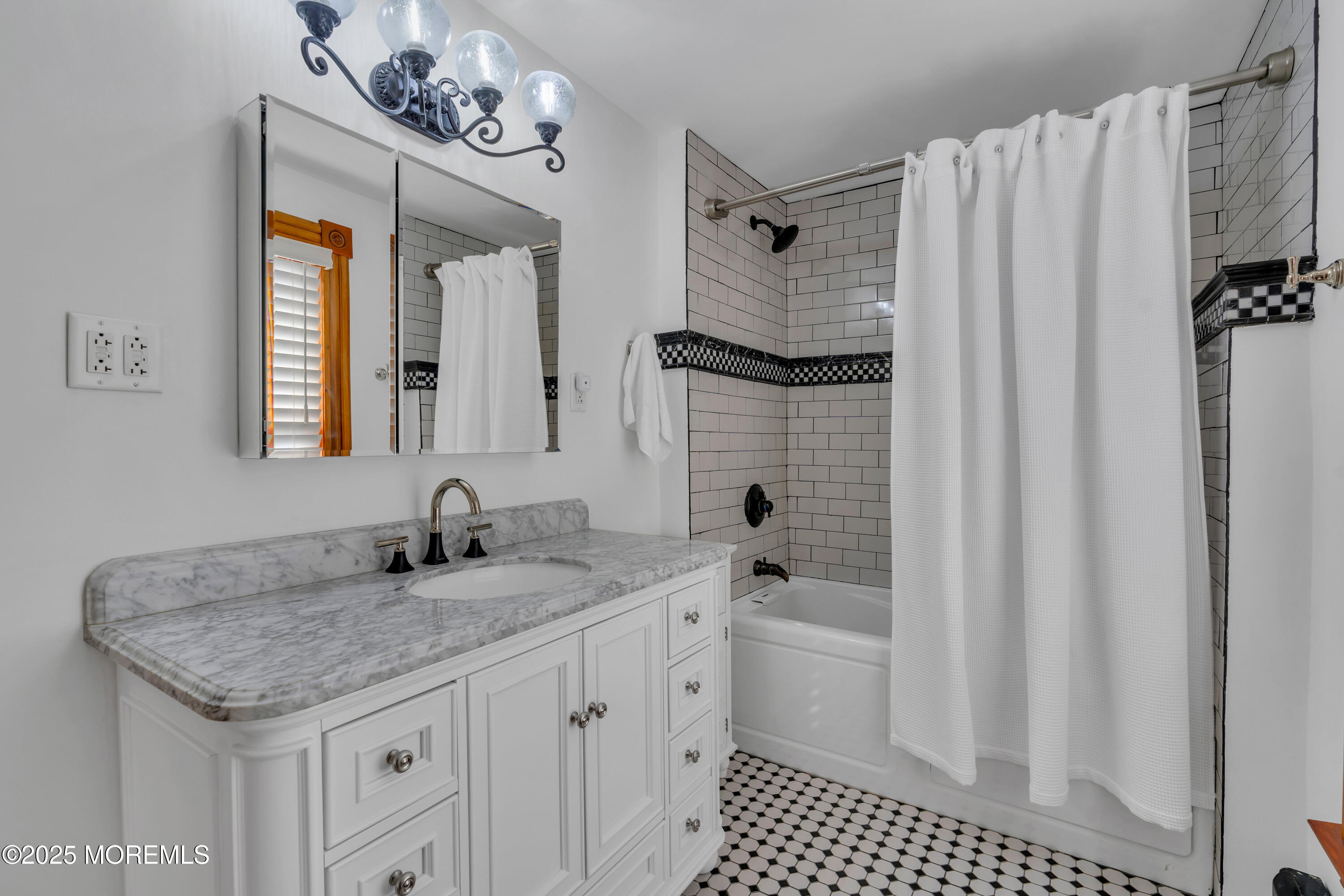 44 Irving Place Red Bank, NJ 07701 - Photo 44 of 74 a bathroom with a sink a vanity and a mirror