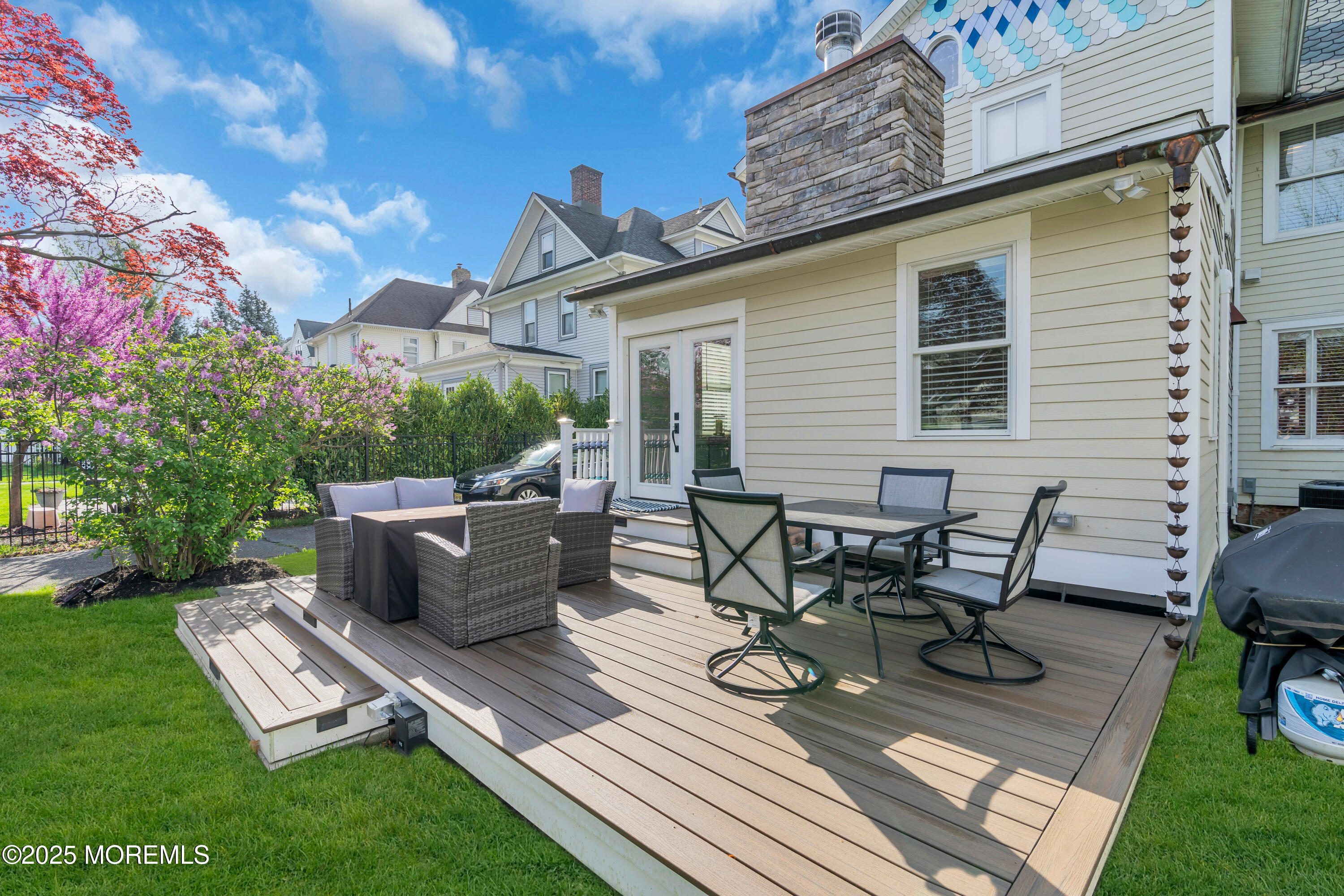44 Irving Place Red Bank, NJ 07701 - Photo 57 of 74 a view of a patio with table and chairs and potted plants