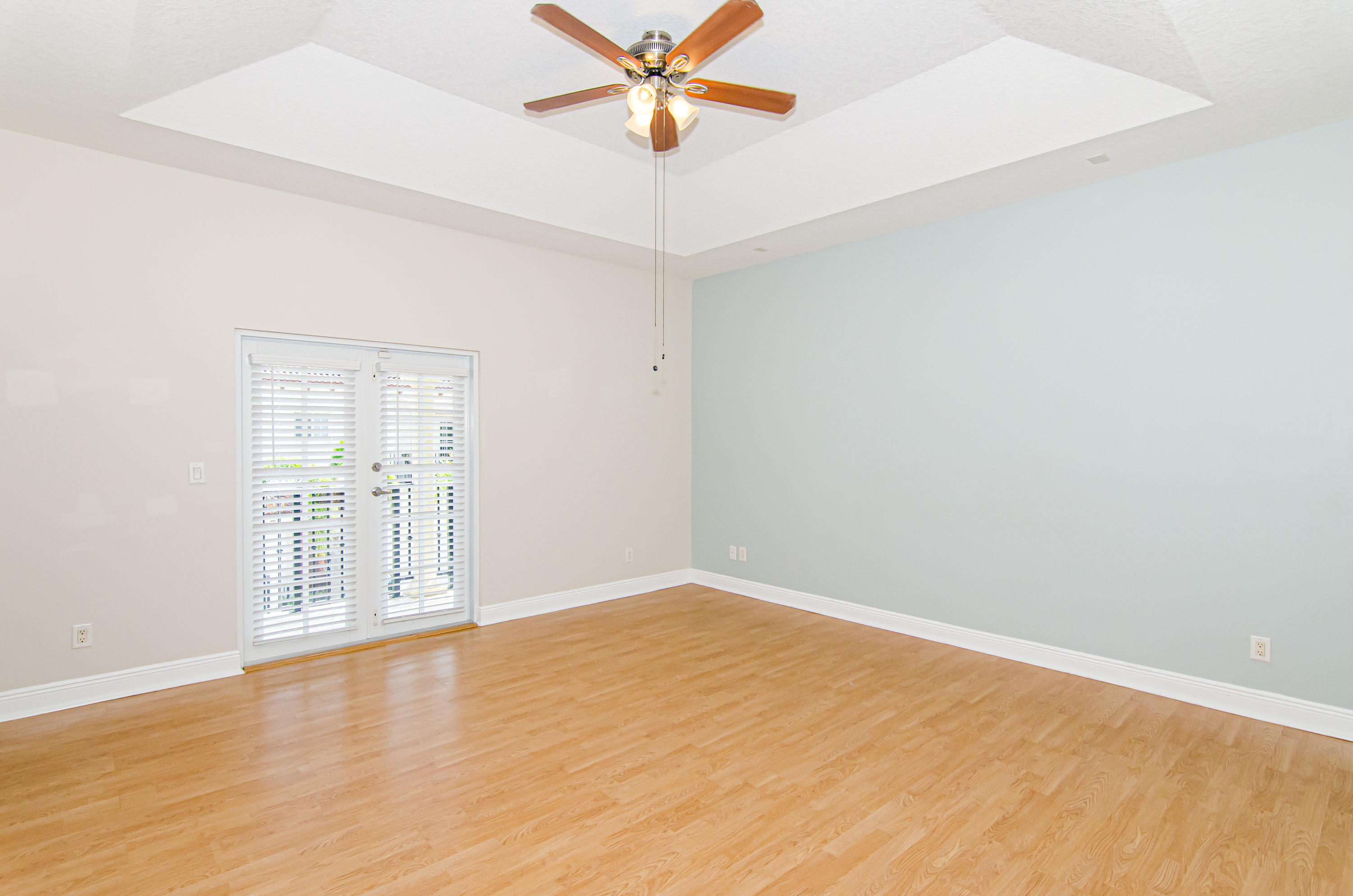 816 Prosperity Farms Road, Unit 2 North Palm Beach, FL 33408 - Photo 13 of 30 wooden floor in an empty room with a window