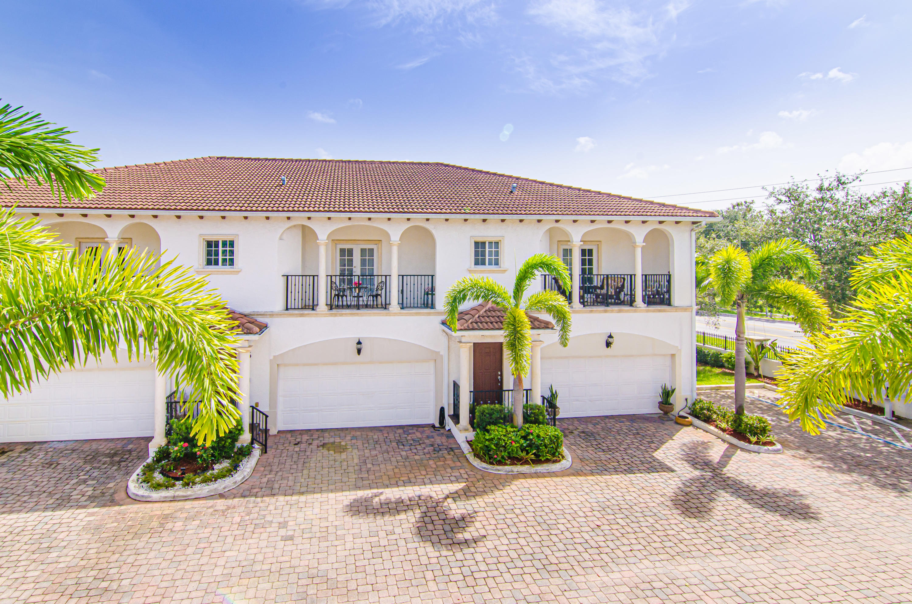 816 Prosperity Farms Road, Unit 2 North Palm Beach, FL 33408 - Photo 17 of 30 a front view of a house with garden