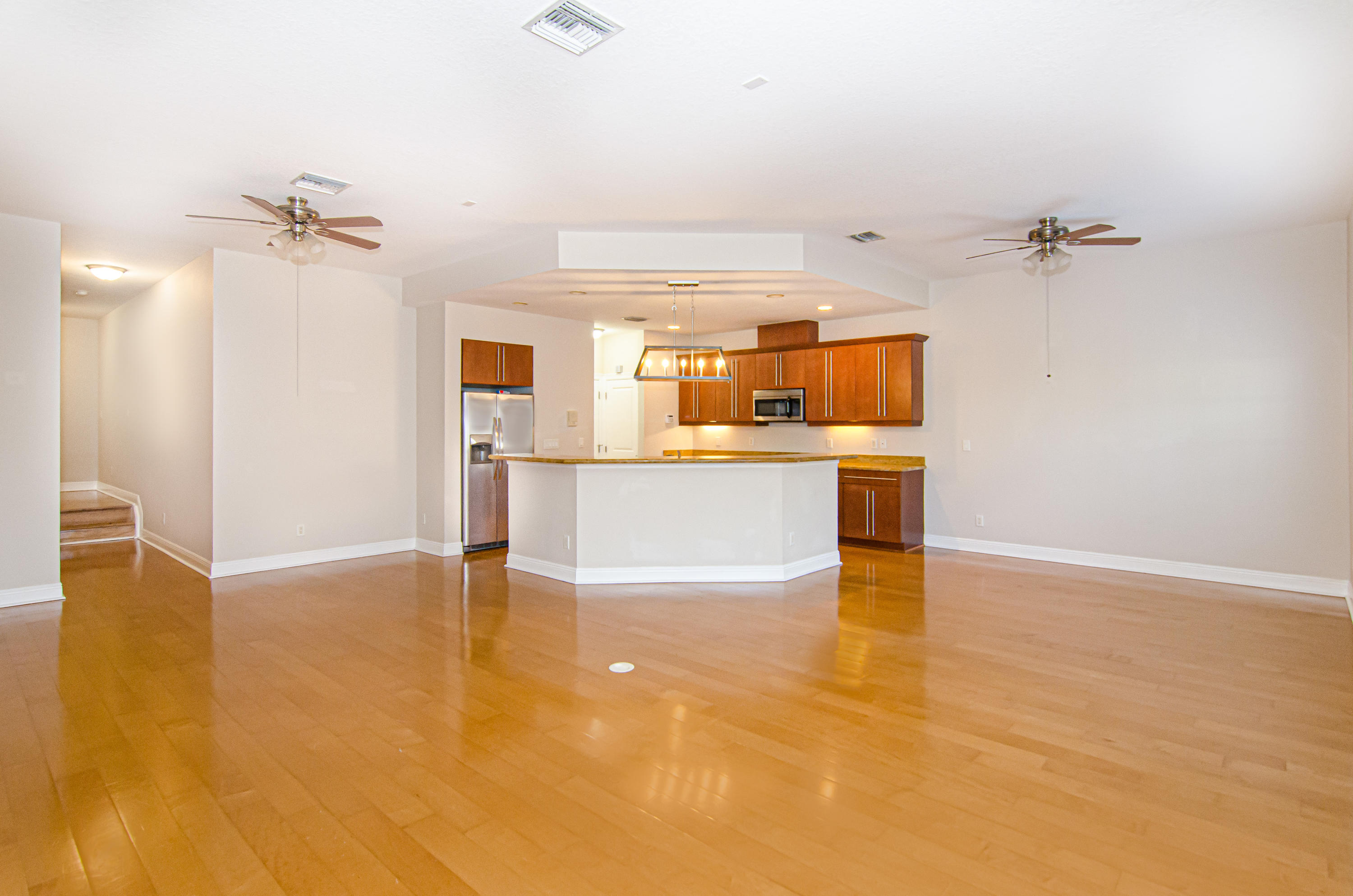 816 Prosperity Farms Road, Unit 2 North Palm Beach, FL 33408 - Photo 2 of 30 wooden floor in an empty room with a window