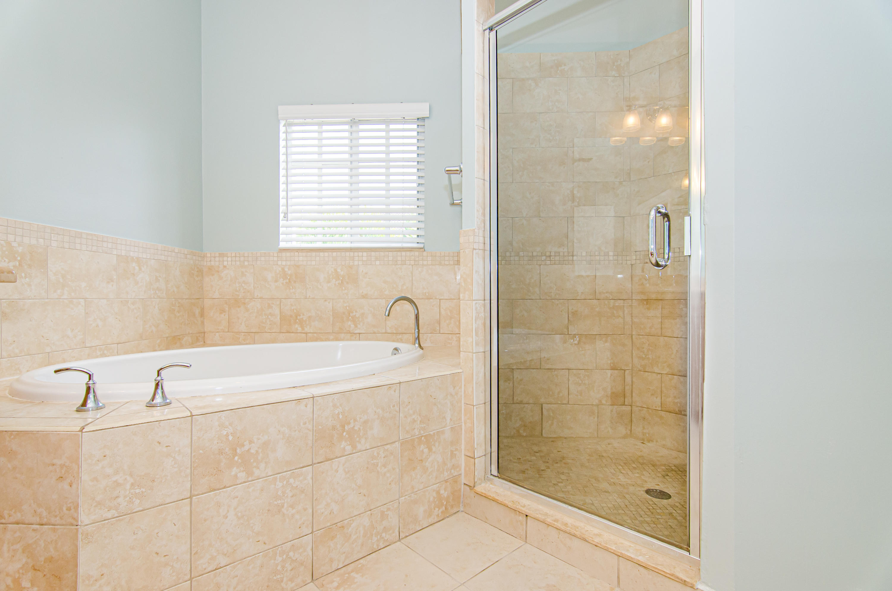 816 Prosperity Farms Road, Unit 2 North Palm Beach, FL 33408 - Photo 21 of 30 a bathroom with a bathtub and shower