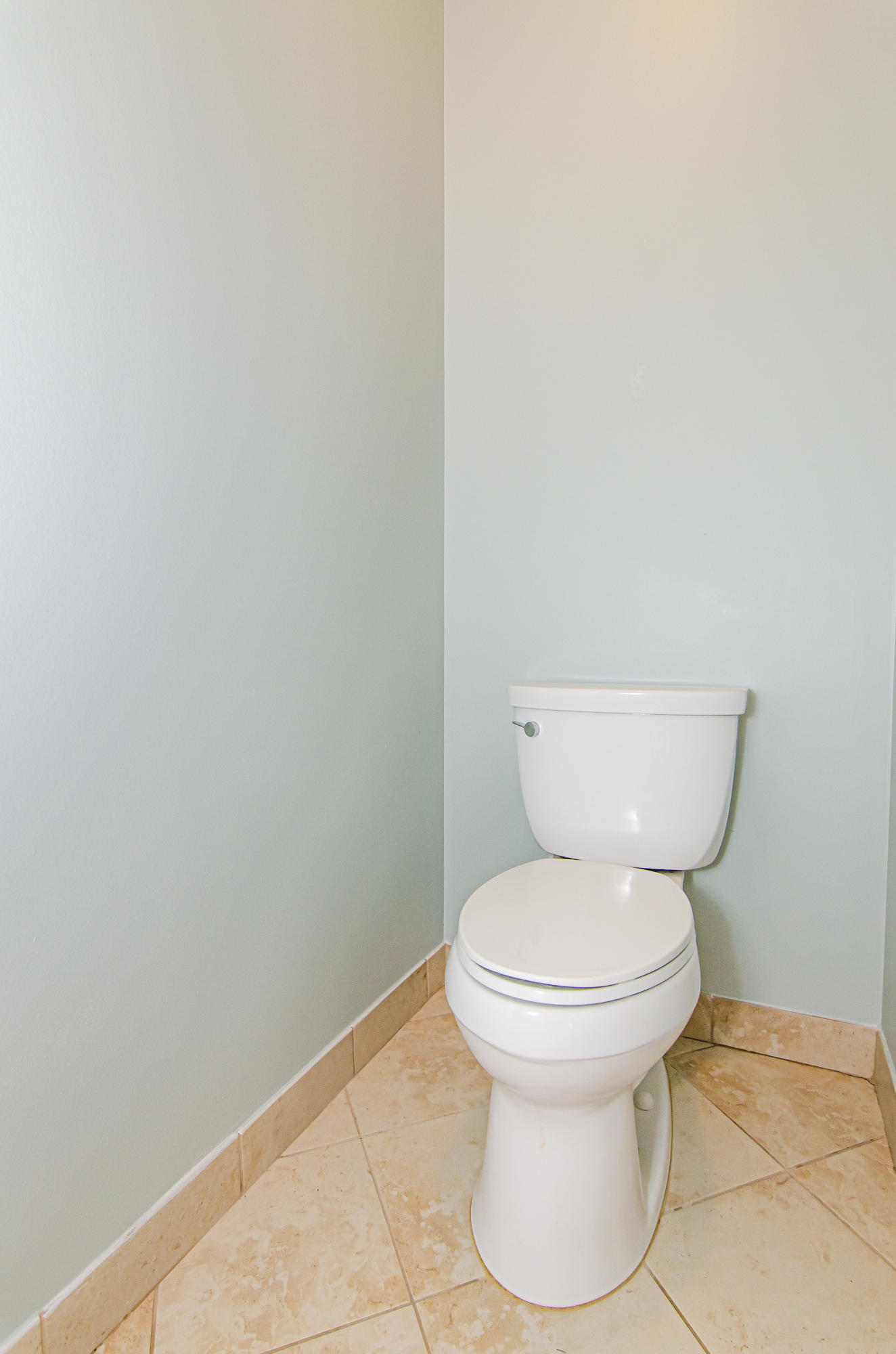 816 Prosperity Farms Road, Unit 2 North Palm Beach, FL 33408 - Photo 22 of 30 a white toilet sitting next to a white wall
