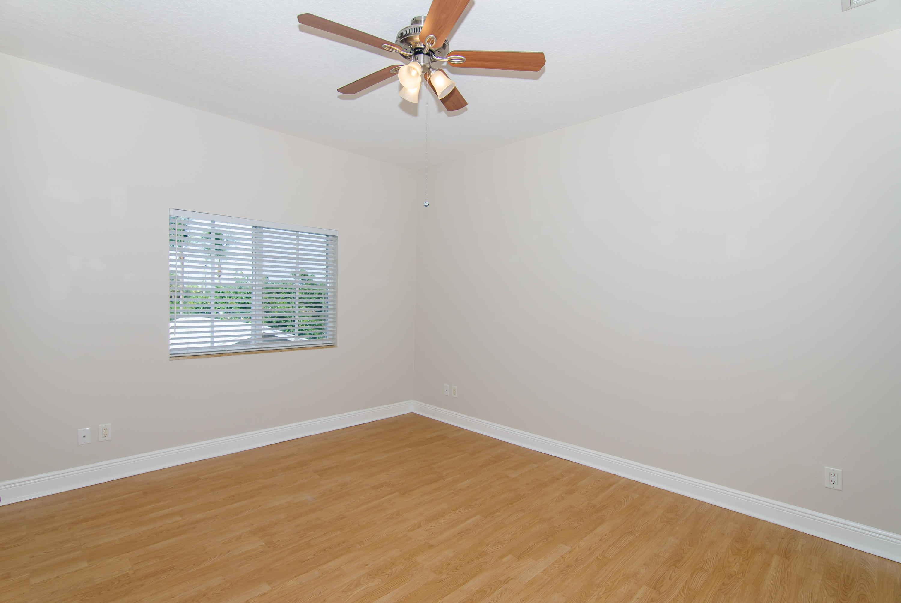816 Prosperity Farms Road, Unit 2 North Palm Beach, FL 33408 - Photo 23 of 30 an empty room with a window and a fan