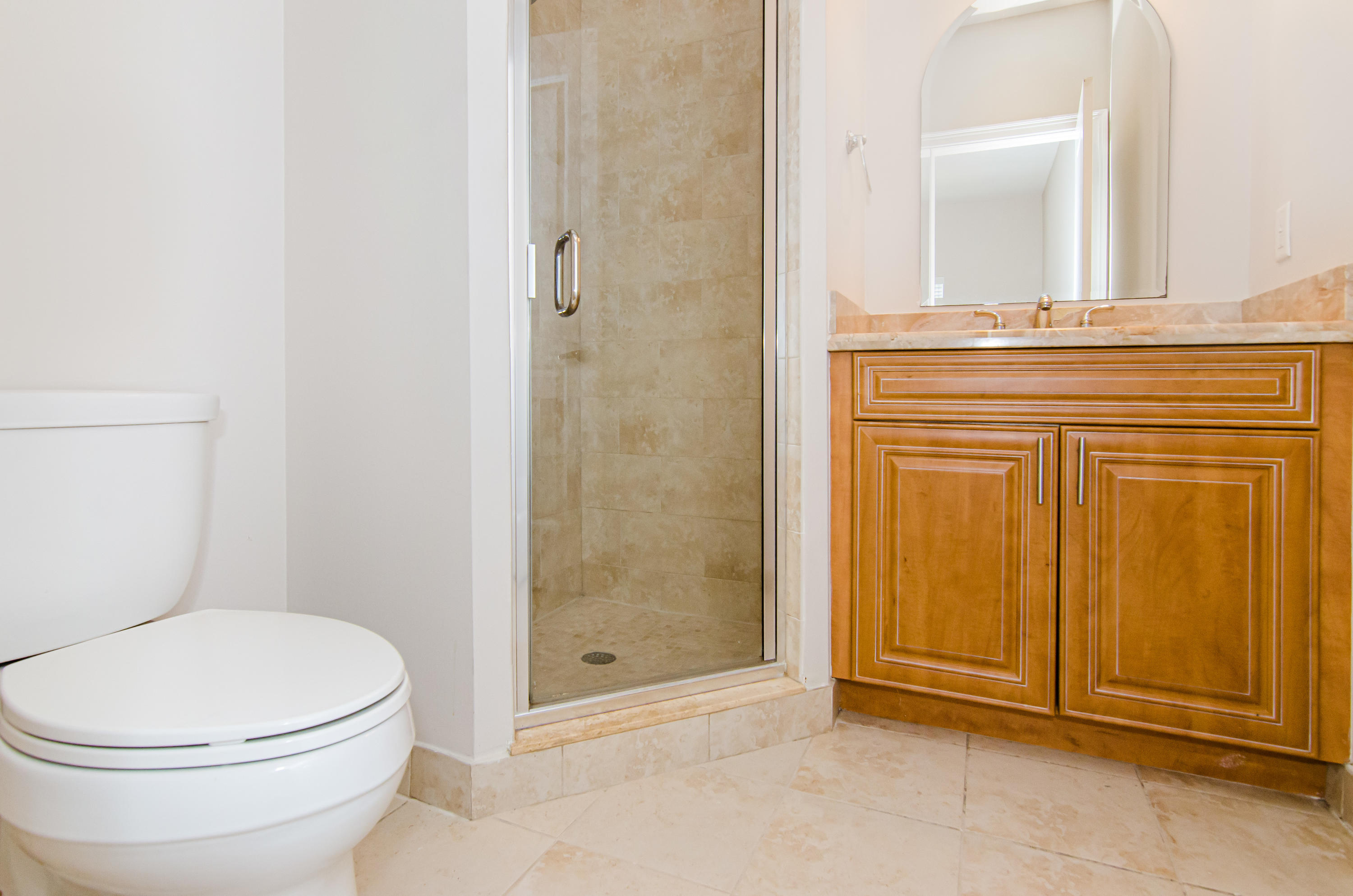816 Prosperity Farms Road, Unit 2 North Palm Beach, FL 33408 - Photo 25 of 30 a bathroom with a toilet and shower