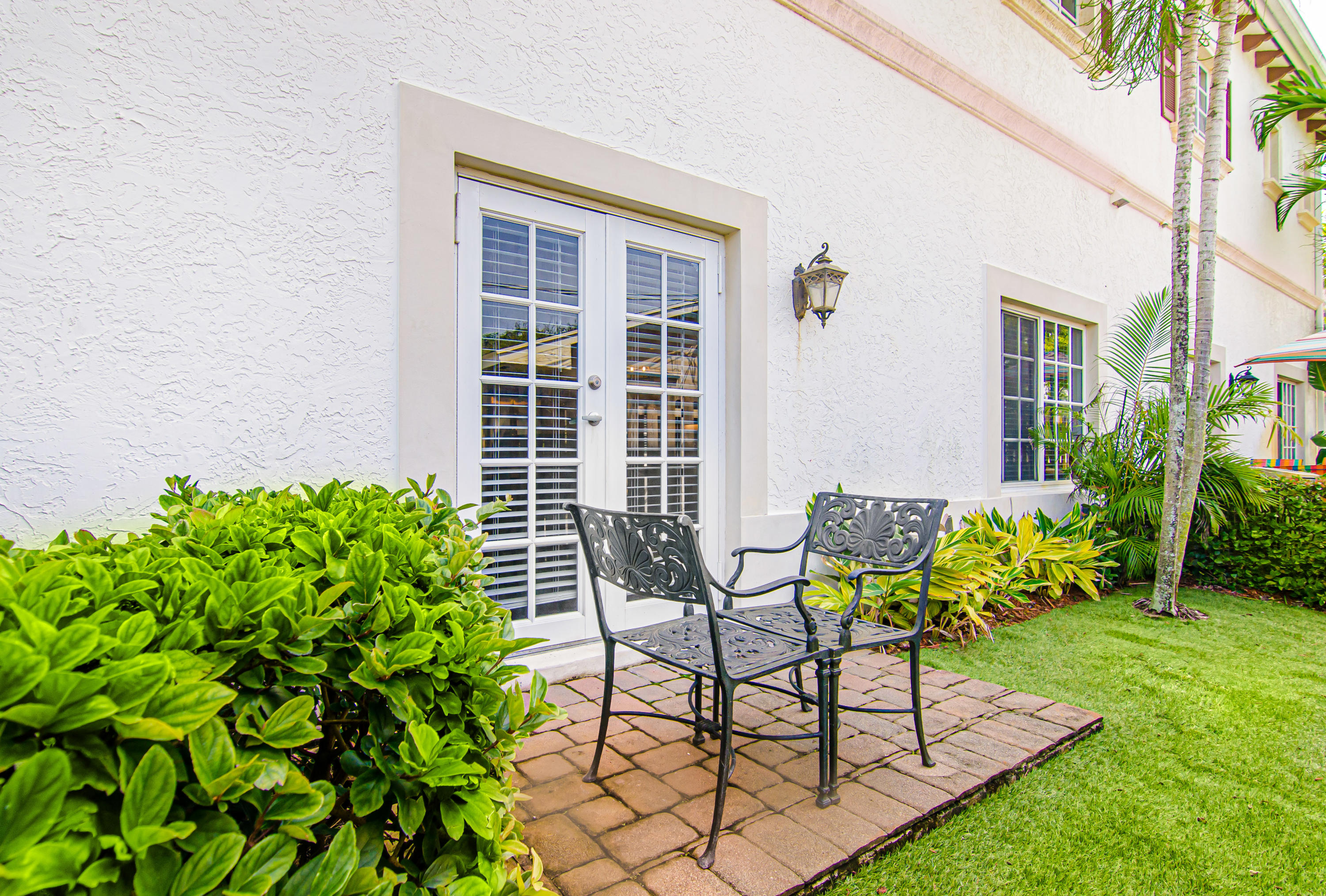 816 Prosperity Farms Road, Unit 2 North Palm Beach, FL 33408 - Photo 29 of 30 a view of a house with backyard and sitting area
