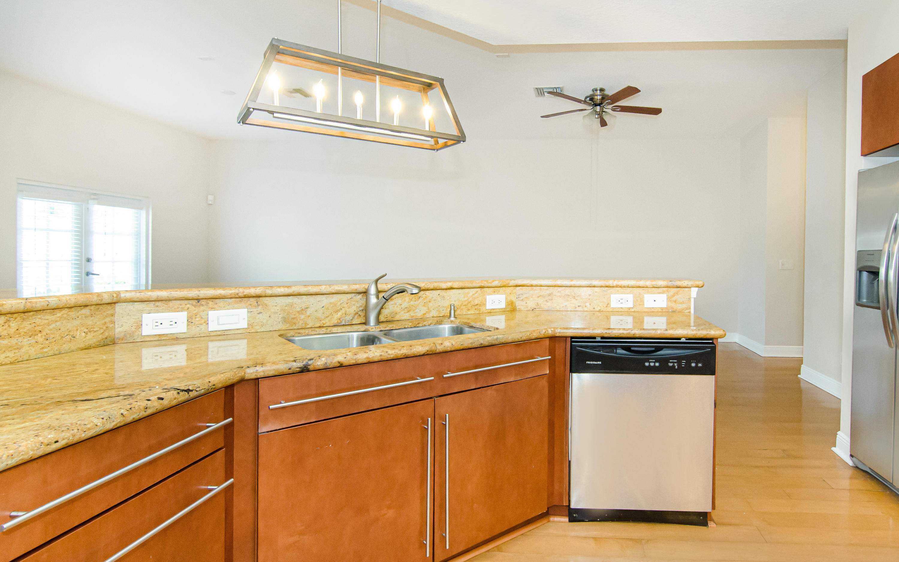 816 Prosperity Farms Road, Unit 2 North Palm Beach, FL 33408 - Photo 9 of 30 a kitchen with stainless steel appliances granite countertop a sink and cabinets
