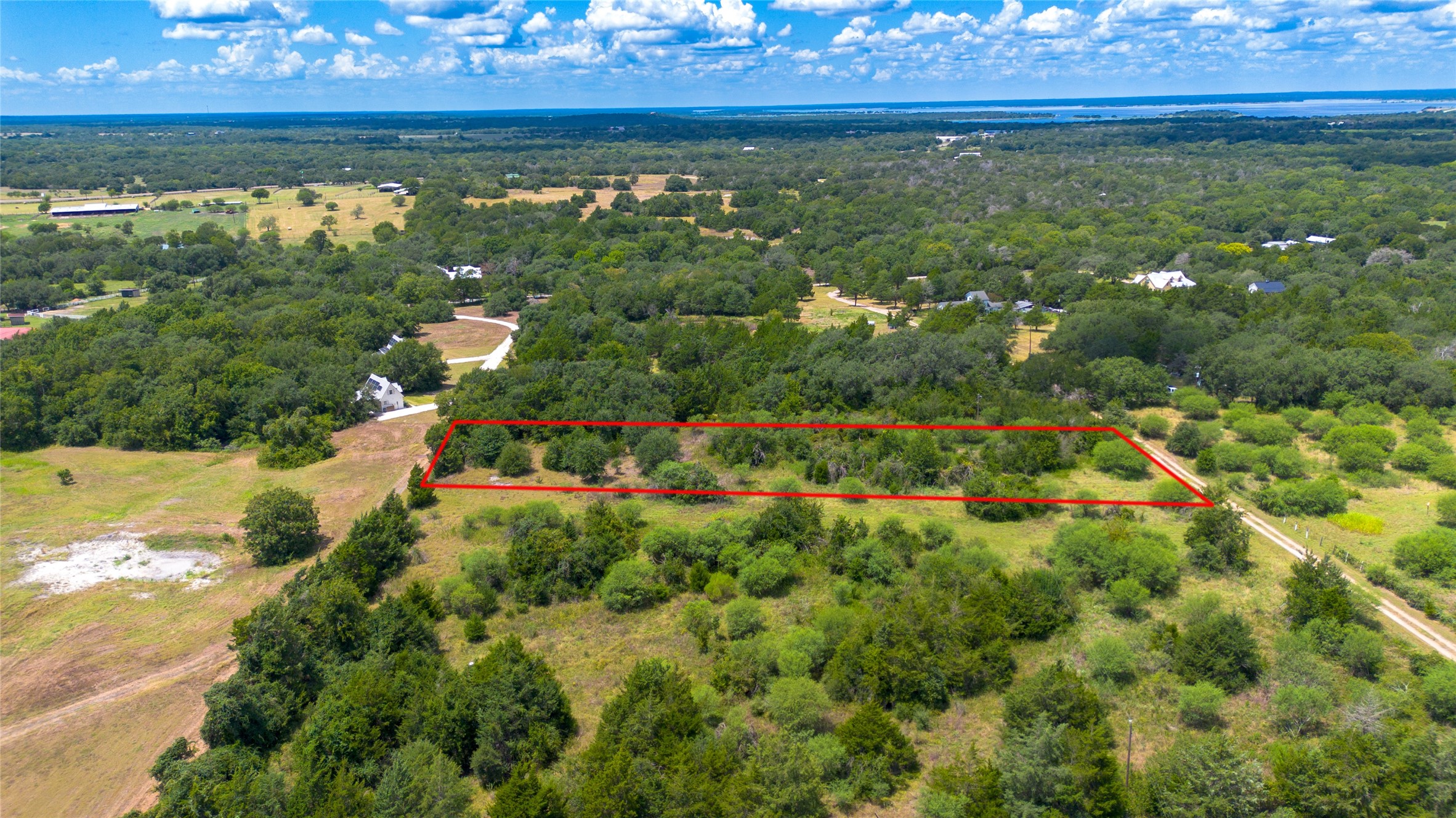 732 Christmas Road Brenham, TX 77833 - Photo 8 of 9 a view of a lake in a yard