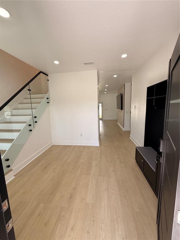 2729 West Union Street Tampa, FL 33607 - Photo 3 of 18 a view of a livingroom with a staircase