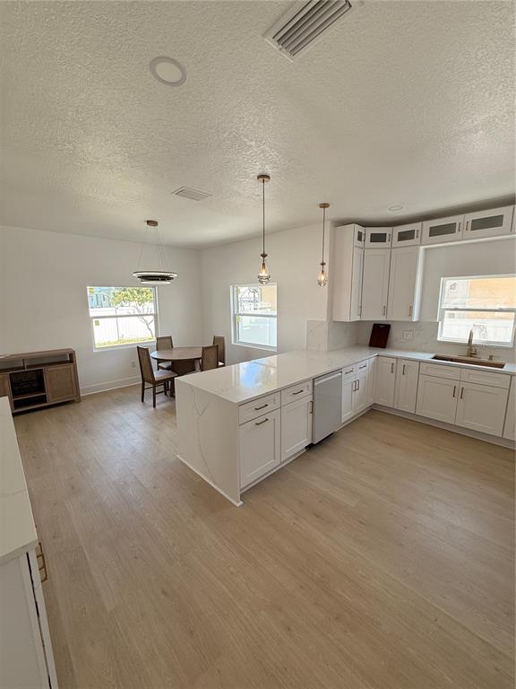 2729 West Union Street Tampa, FL 33607 - Photo 9 of 18 a large white kitchen with cabinets and a couch