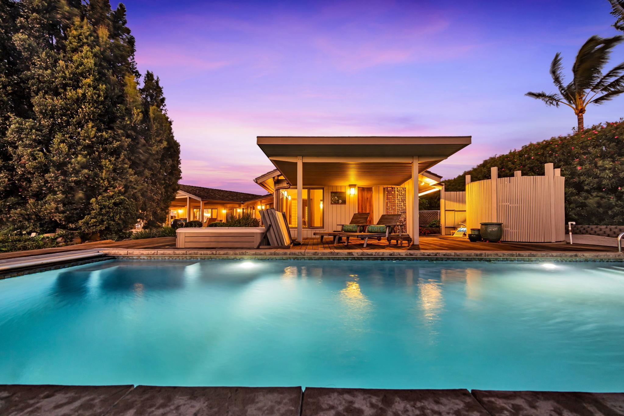 a view of a swimming pool with an outdoor space and seating area