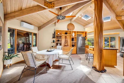 a dining room with a table and chairs