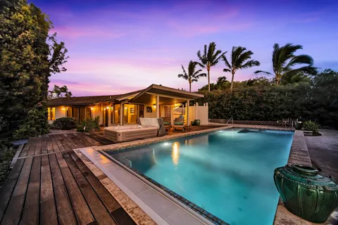 a view of a room with gym equipment and a large window