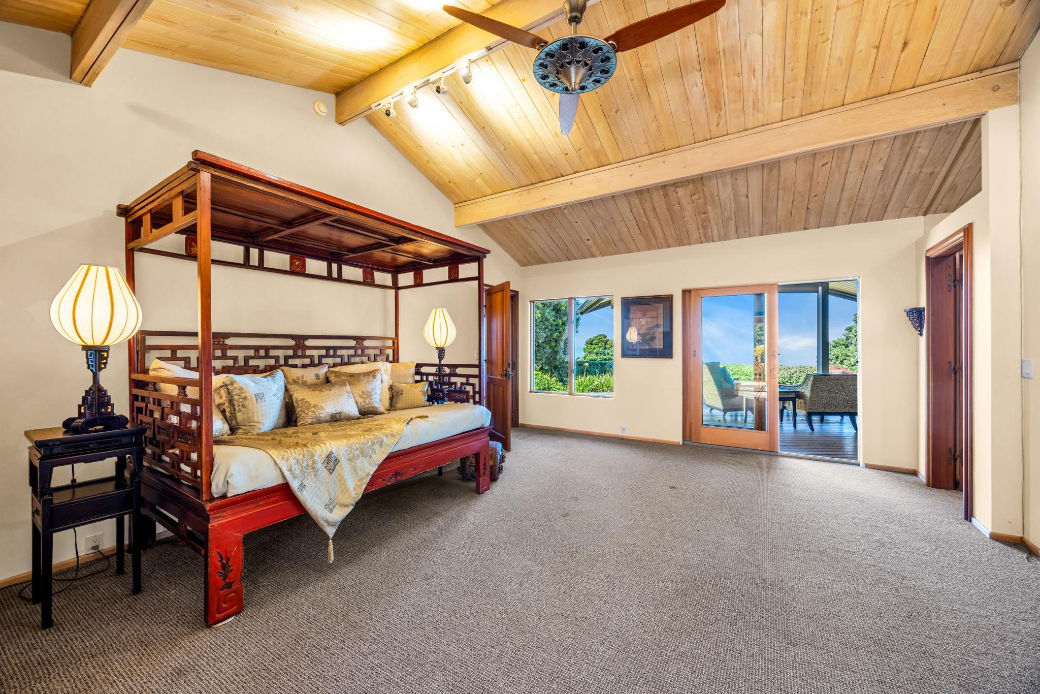 50 Poha Place Makawao, HI 96768 - Photo 25 of 50 a bedroom with furniture and a window