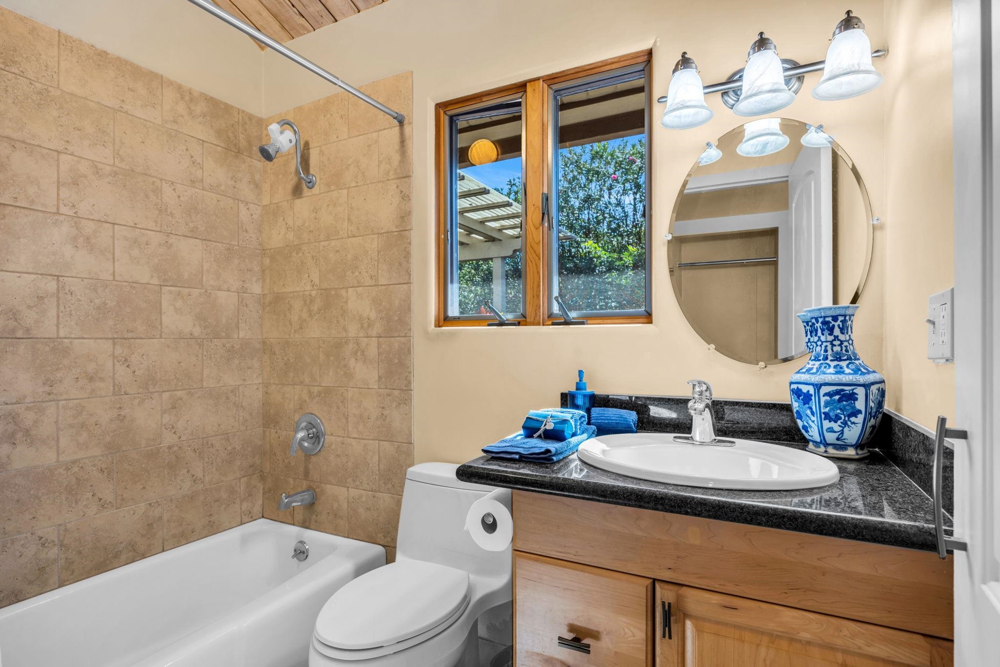 50 Poha Place Makawao, HI 96768 - Photo 27 of 50 a bathroom with a toilet sink and mirror