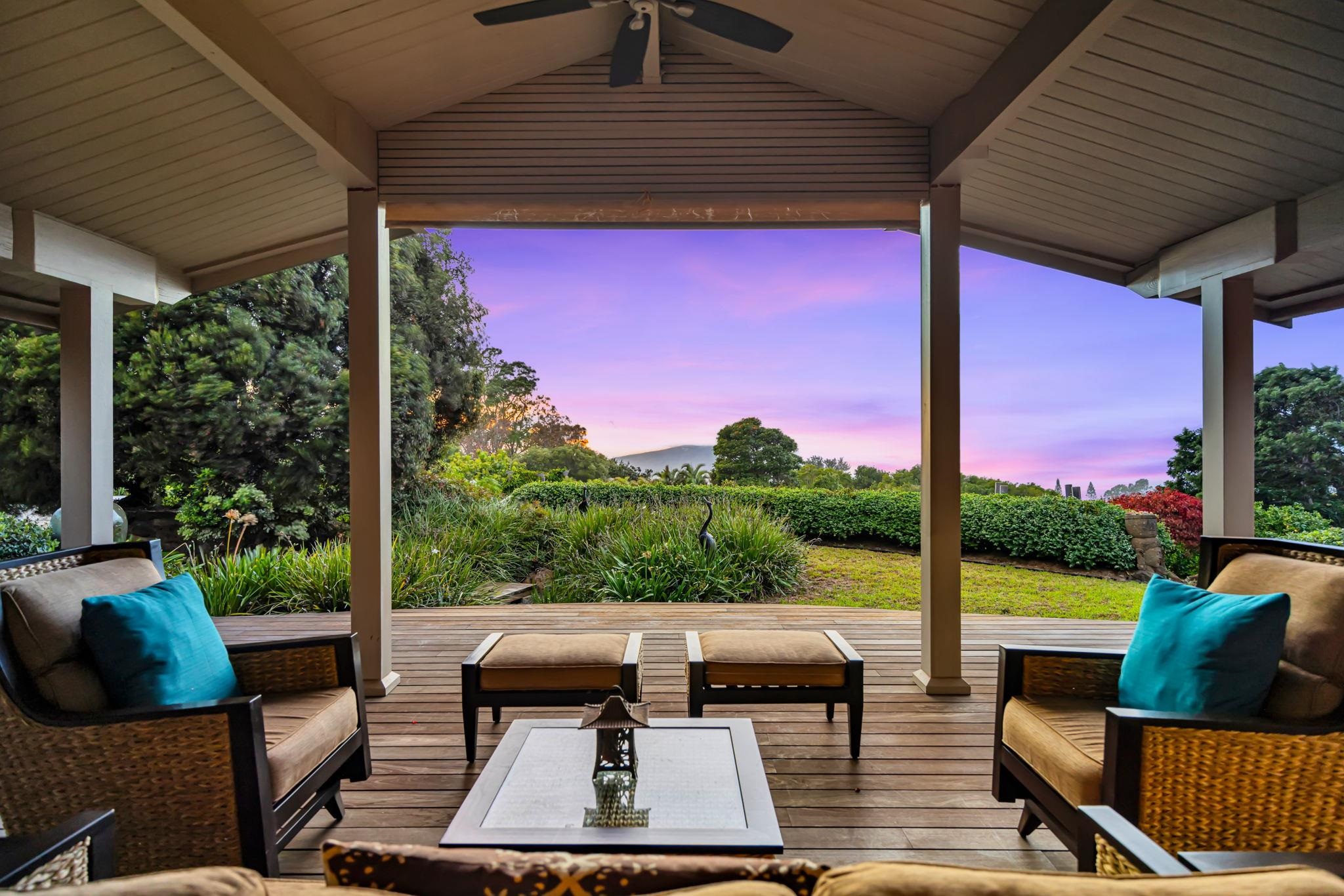 50 Poha Place Makawao, HI 96768 - Photo 3 of 50 a view of a patio with couches chairs potted plants and a palm tree