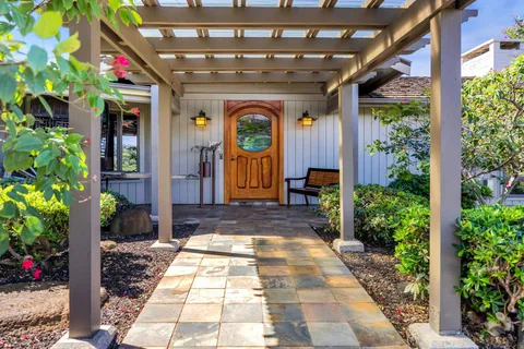 a view of front door with outdoor seating