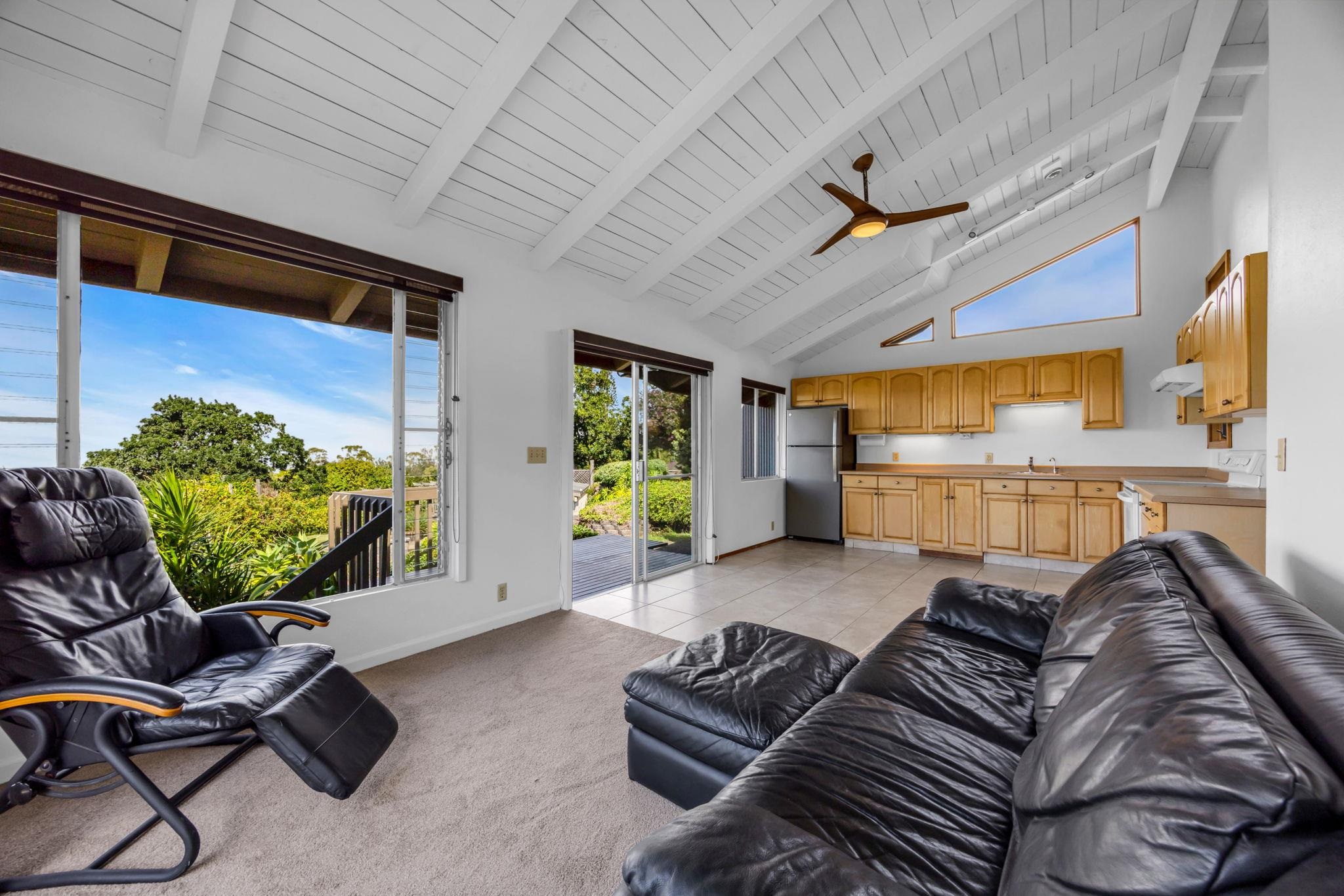50 Poha Place Makawao, HI 96768 - Photo 39 of 50 a living room with furniture ceiling fan and a large window